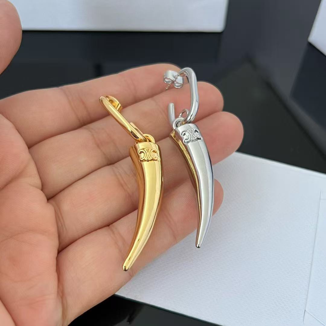 Celine Triomphe Horn Drop Earrings earrings Available in polished gold-tone metal and polished silver-tone metal no gemstones One Size drop length approx 4 5cm