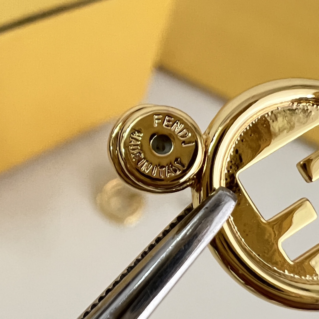 Fendi F Is Fendi earrings gold-tone metal silver-tone metal with clear crystal accents 1 2cm diameter