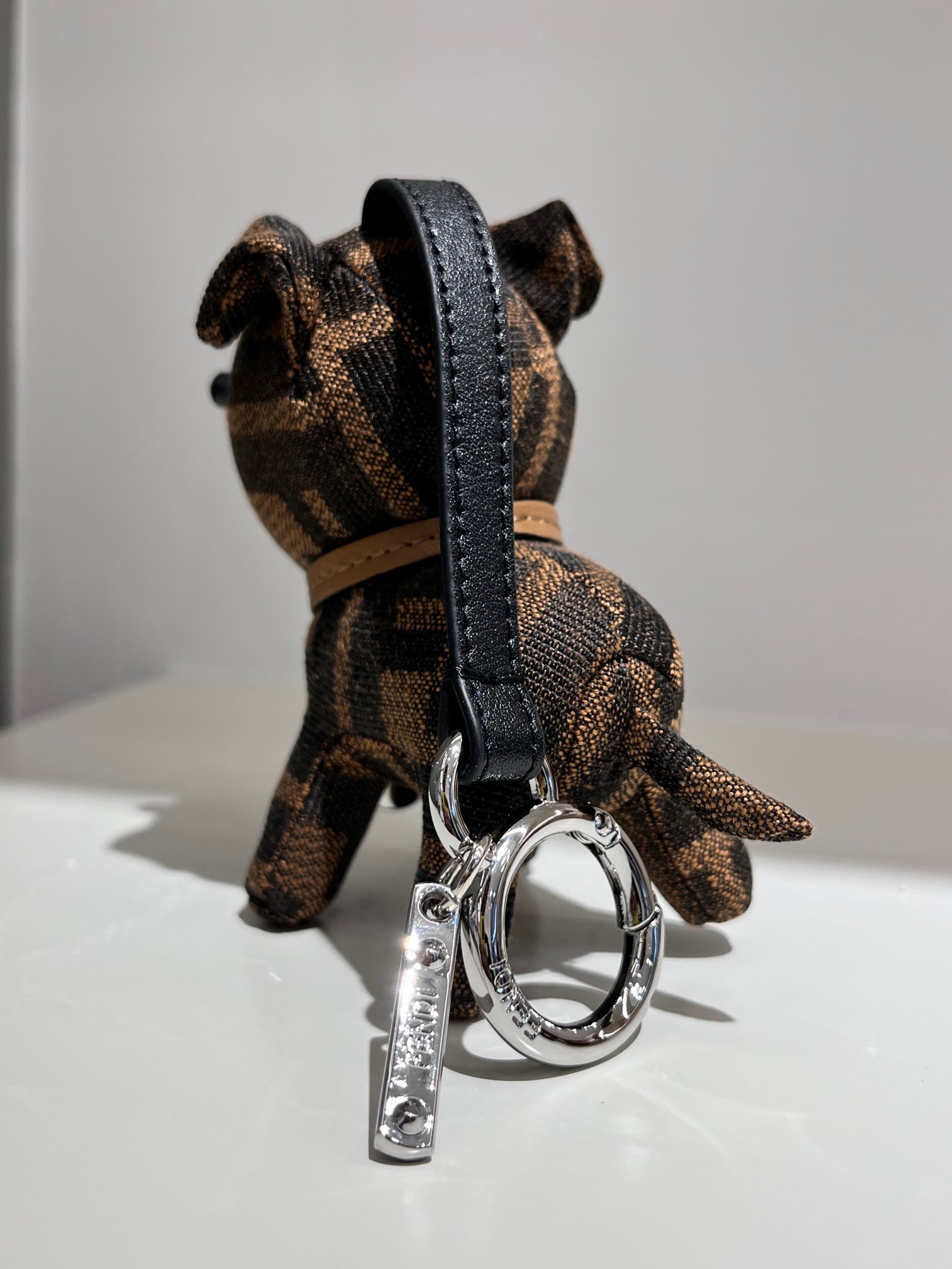 Fendi FF Monogram Dog Charm pendant tobacco brown and black FF jacquard canvas silver-tone metal hardware black leather strap tan leather collar black resin accents 10cm total length with