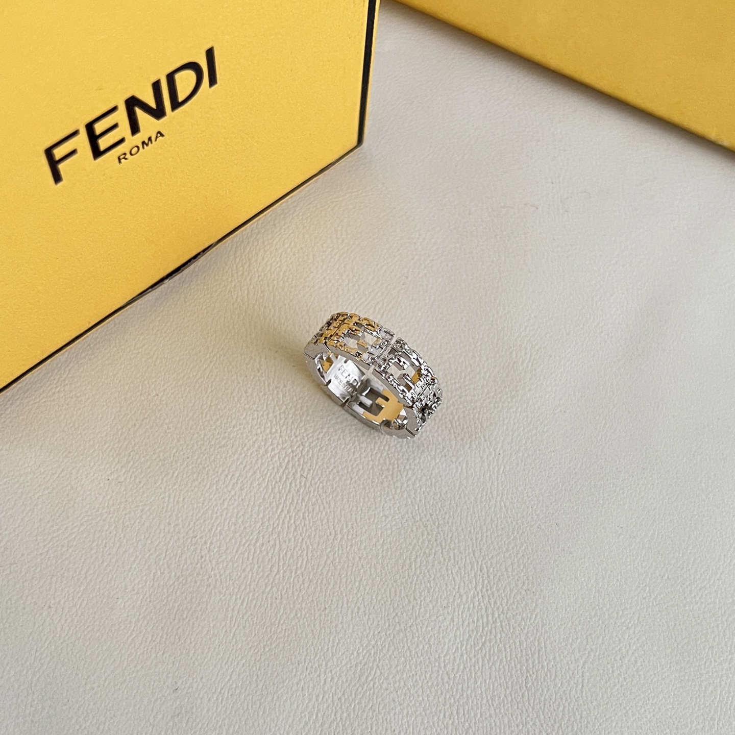 Fendi FF Logo Textured Band Ring ring Silver-tone metal with clear crystal accents US 7