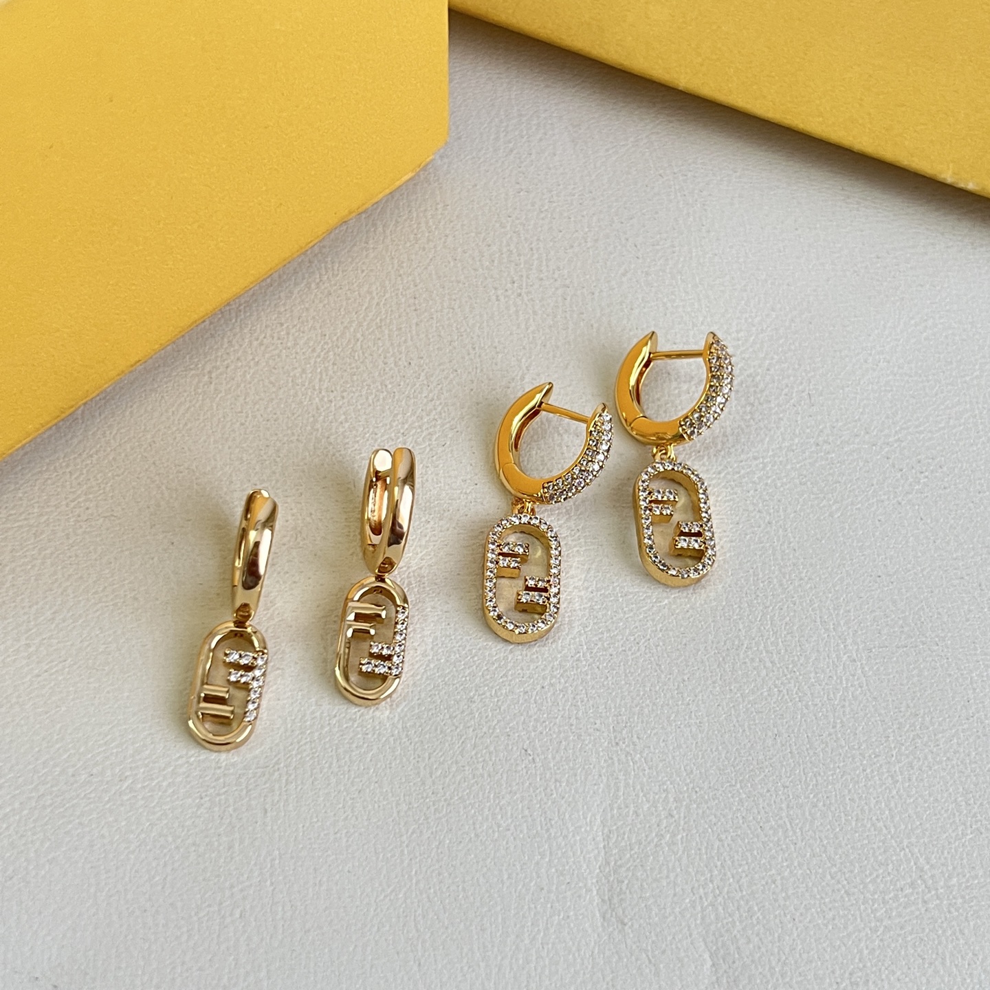 Fendi O Lock earrings gold-tone metal with clear crystal accents 1 5cm drop length