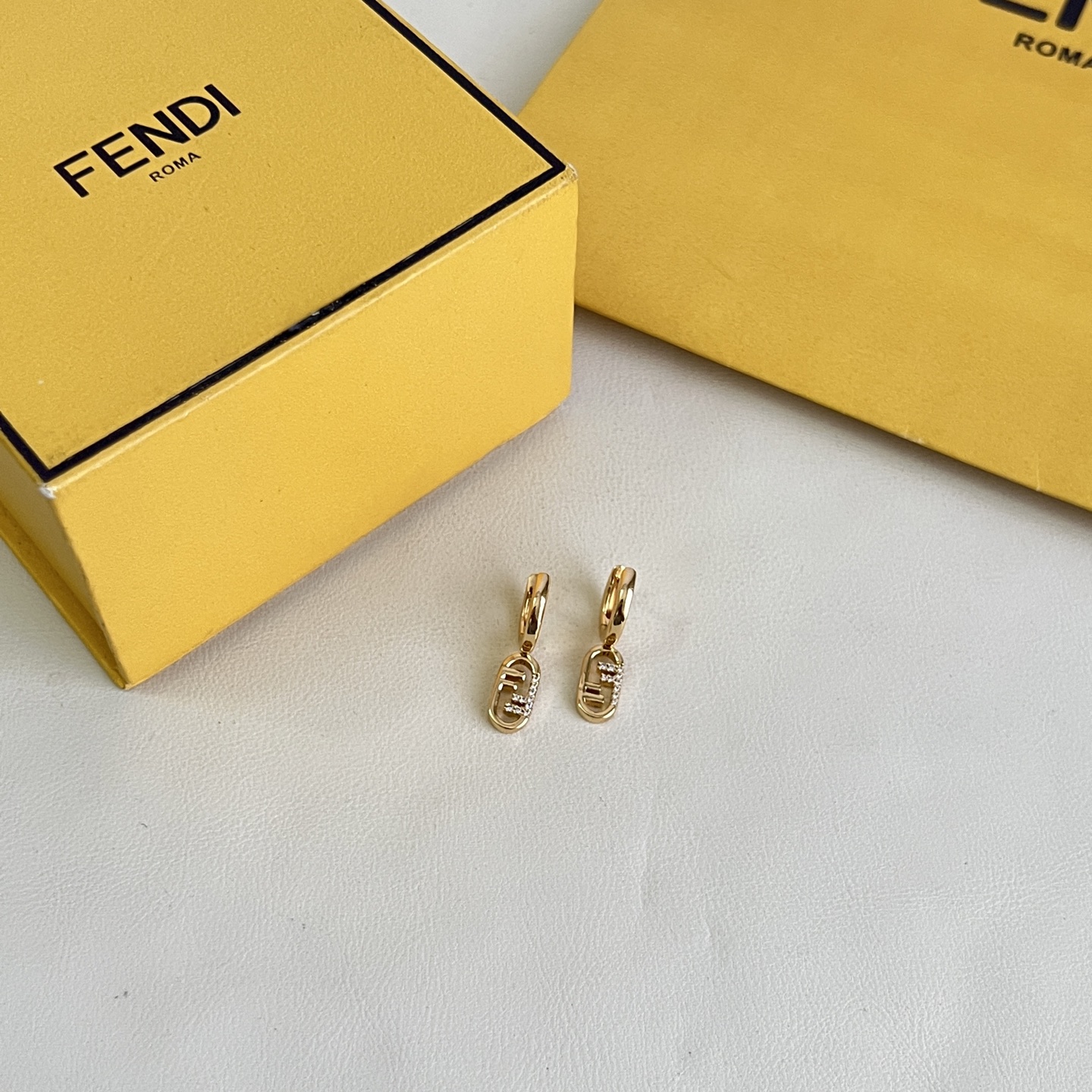 Fendi O Lock earrings gold-tone metal with clear crystal accents 1 5cm drop length