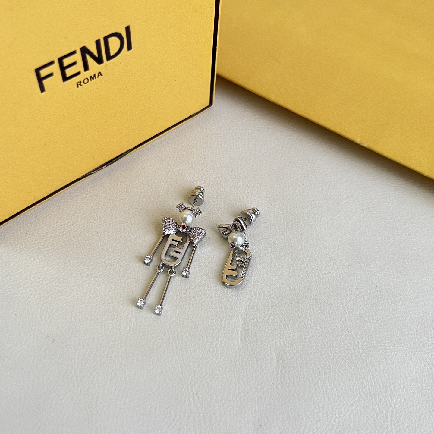Fendi FF Robot Asymmetric Earrings earrings Available in two variants gold-tone metal with white faux pearl clear pave crystals and pink accent stone silver-tone metal with white faux pearl clear pave crystals and pink accent stone One Size drop length approx 3 5cm