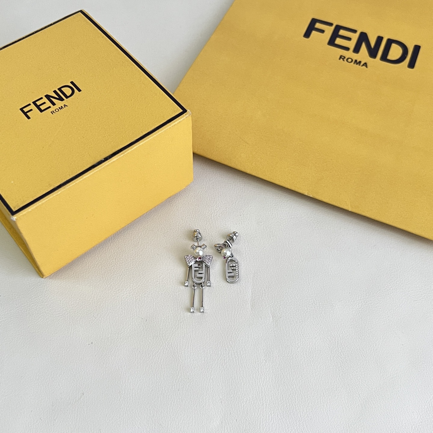 Fendi FF Robot Asymmetric Earrings earrings Available in two variants gold-tone metal with white faux pearl clear pave crystals and pink accent stone silver-tone metal with white faux pearl clear pave crystals and pink accent stone One Size drop length approx 3 5cm