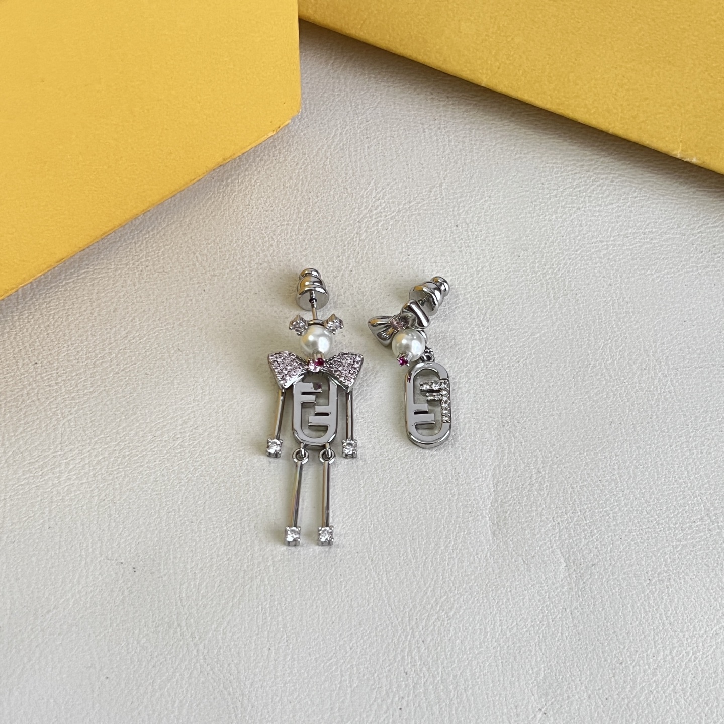 Fendi FF Robot Asymmetric Earrings earrings Available in two variants gold-tone metal with white faux pearl clear pave crystals and pink accent stone silver-tone metal with white faux pearl clear pave crystals and pink accent stone One Size drop length approx 3 5cm
