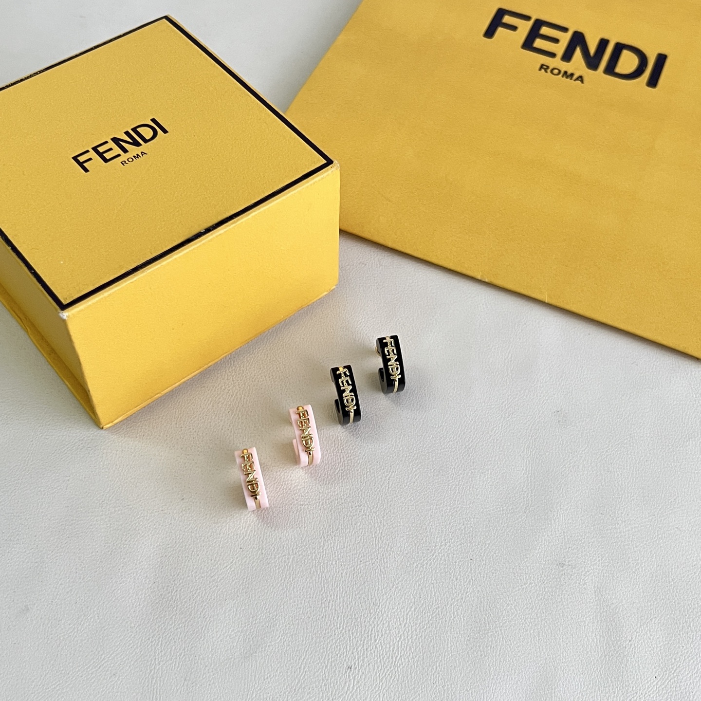 Fendi Fendigraphy Logo Hoop Earrings earrings Gold-tone metal with black enamel and light pink enamel options 10mm hoop diameter