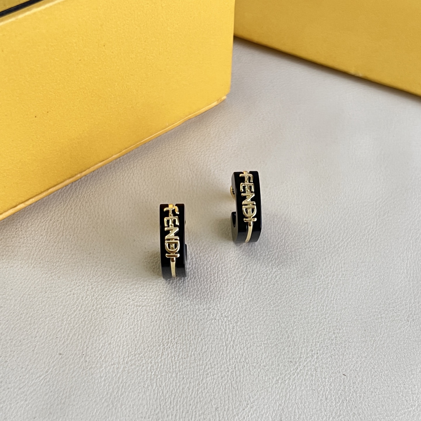 Fendi Fendigraphy Logo Hoop Earrings earrings Gold-tone metal with black enamel and light pink enamel options 10mm hoop diameter