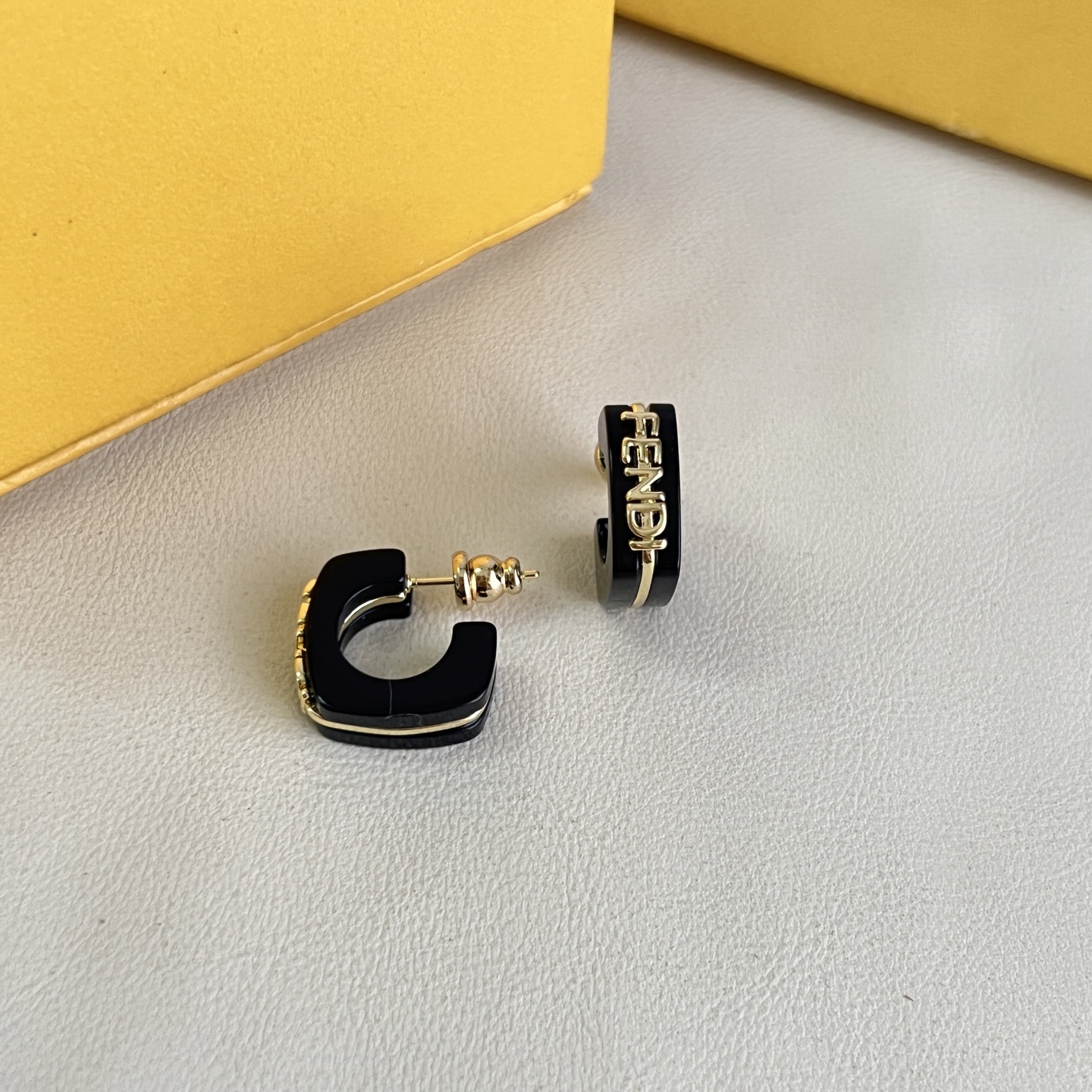 Fendi Fendigraphy Logo Hoop Earrings earrings Gold-tone metal with black enamel and light pink enamel options 10mm hoop diameter