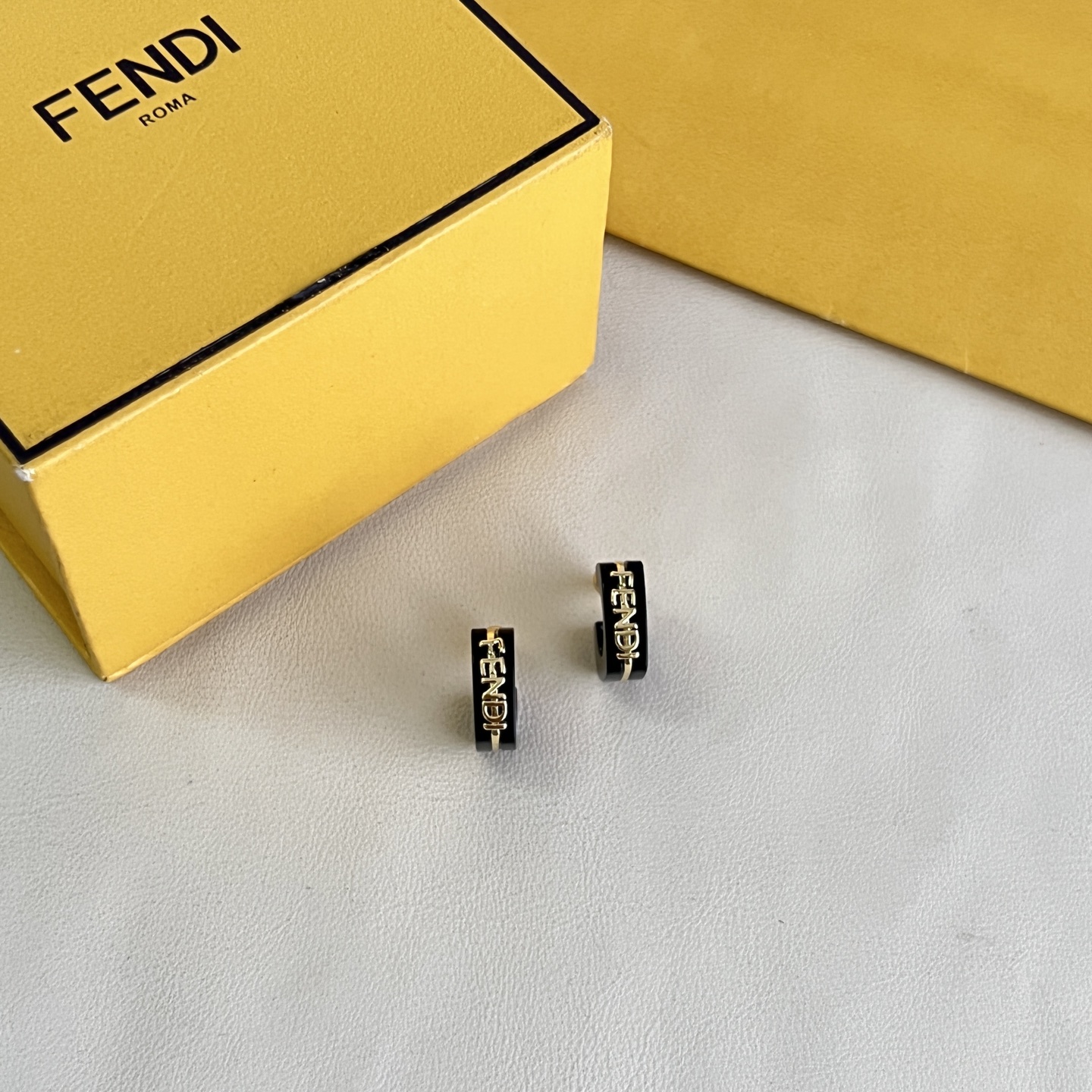 Fendi Fendigraphy Logo Hoop Earrings earrings Gold-tone metal with black enamel and light pink enamel options 10mm hoop diameter