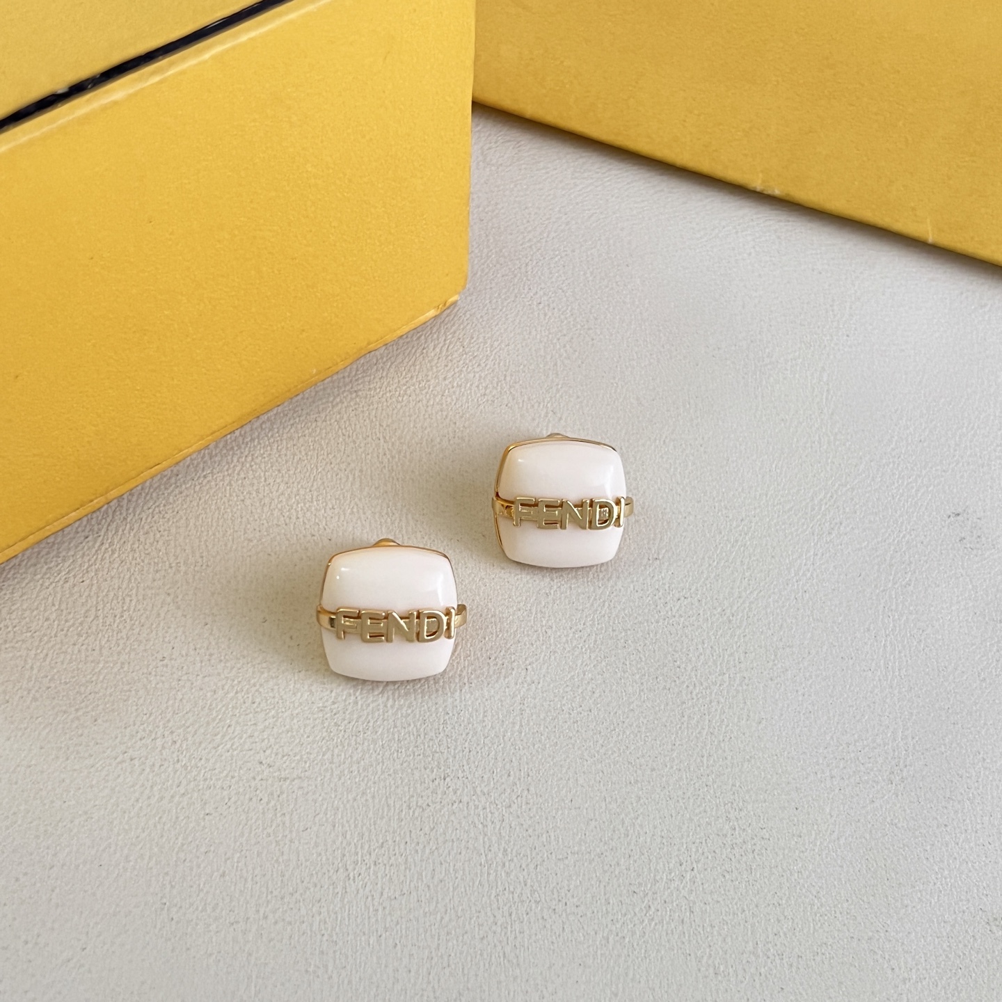 Fendi Fendi Logo Cushion Stud Earrings earrings Gold-tone metal with white pink or black resin accents 1cm stud diameter