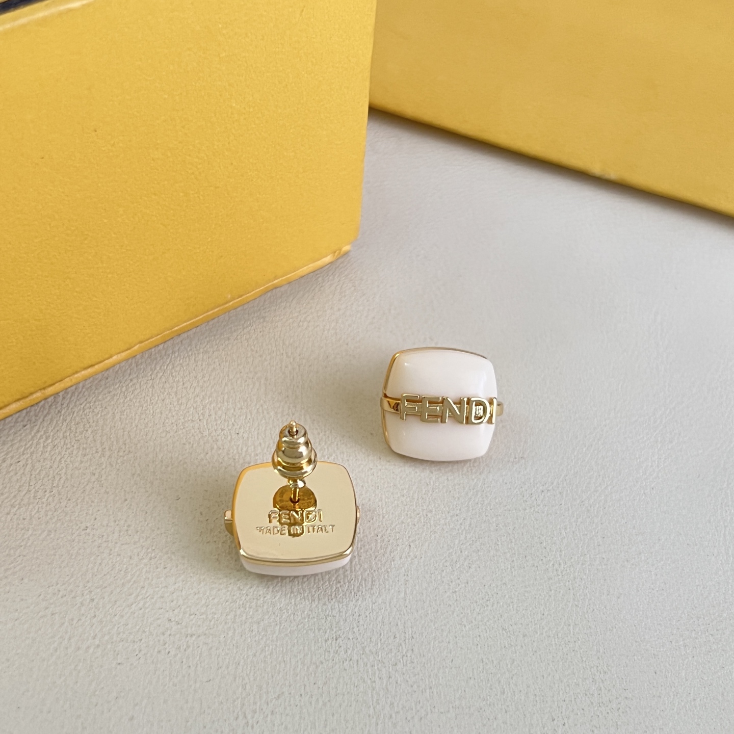 Fendi Fendi Logo Cushion Stud Earrings earrings Gold-tone metal with white pink or black resin accents 1cm stud diameter