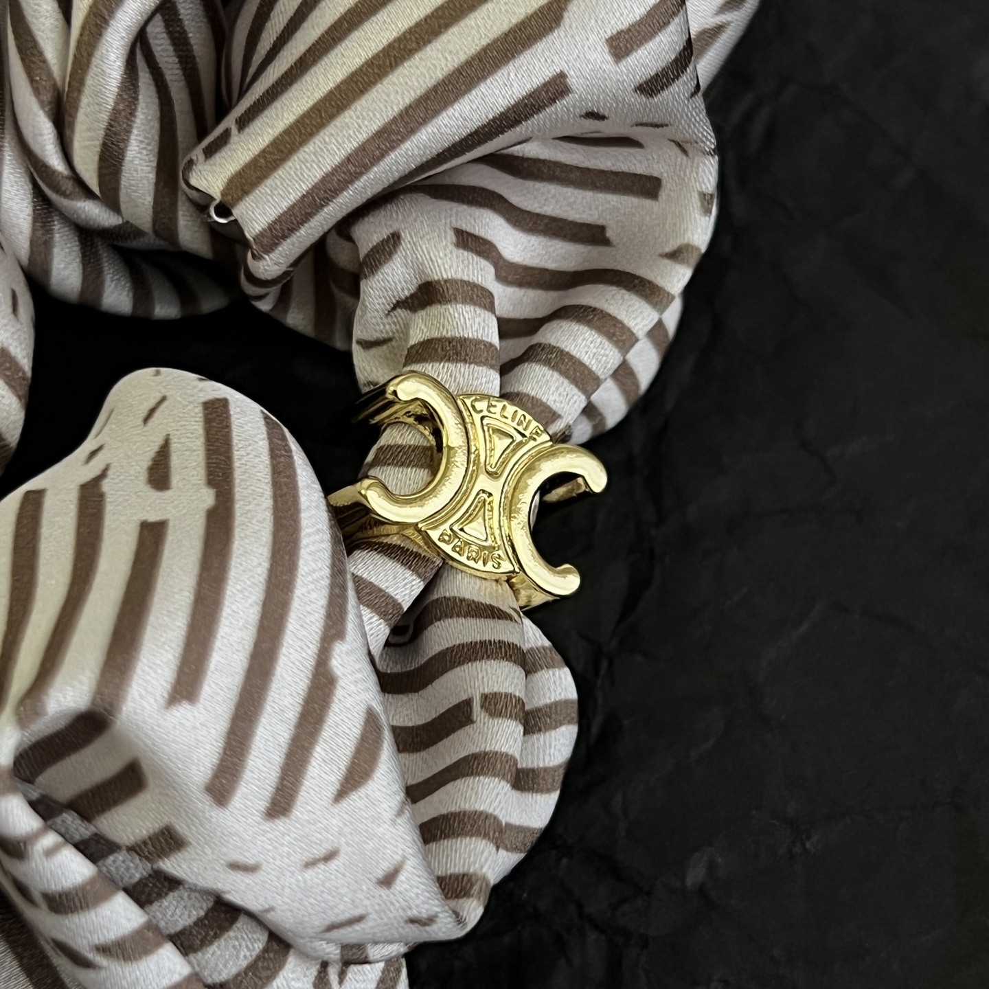 Celine Triomphe Striped Silk Scrunchie bracelet Ivory and brown striped silk with gold-tone Triomphe metal hardware One Size 10cm diameter