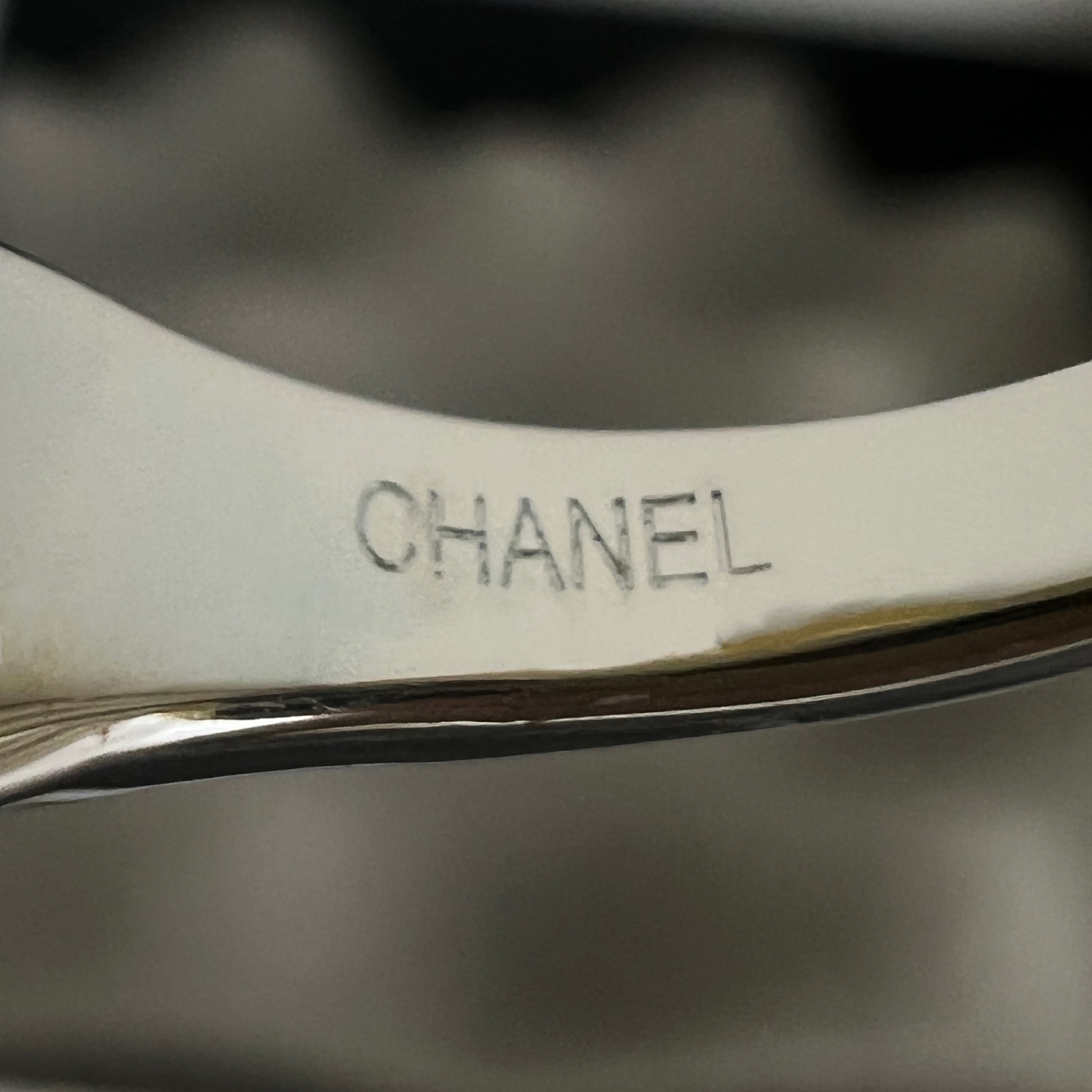 Chanel CC Heart Enamel Signet Ring ring silver-toned metal with coral red and black enamel heart accents featuring interlocking CC logo adjustable open band