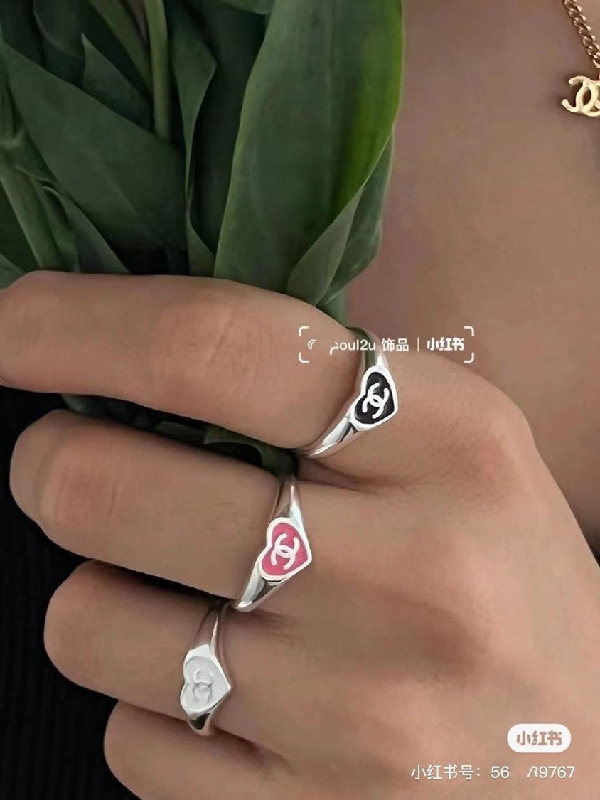 Chanel CC Heart Enamel Signet Ring ring silver-toned metal with coral red and black enamel heart accents featuring interlocking CC logo adjustable open band