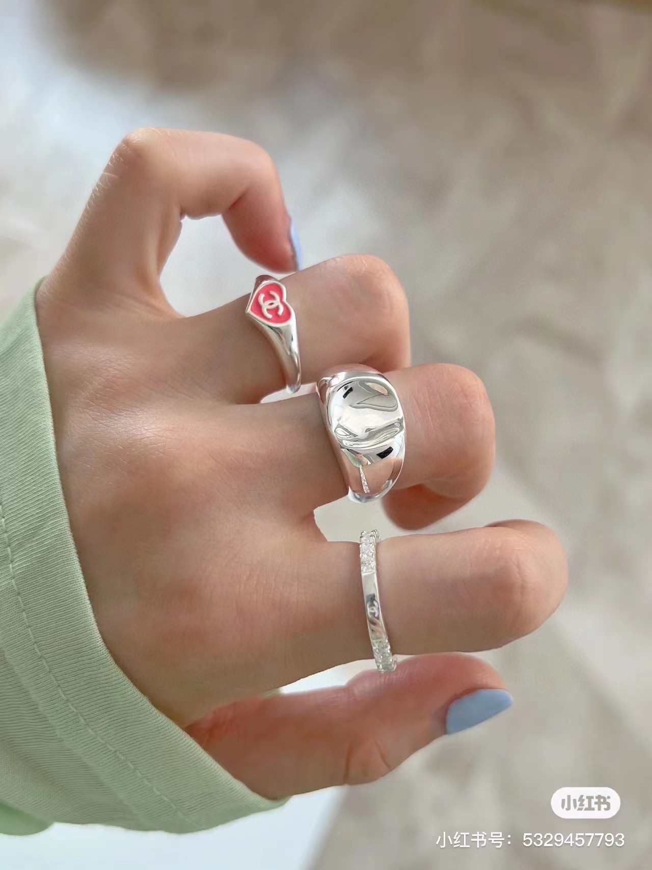Chanel CC Heart Enamel Signet Ring ring silver-toned metal with coral red and black enamel heart accents featuring interlocking CC logo adjustable open band