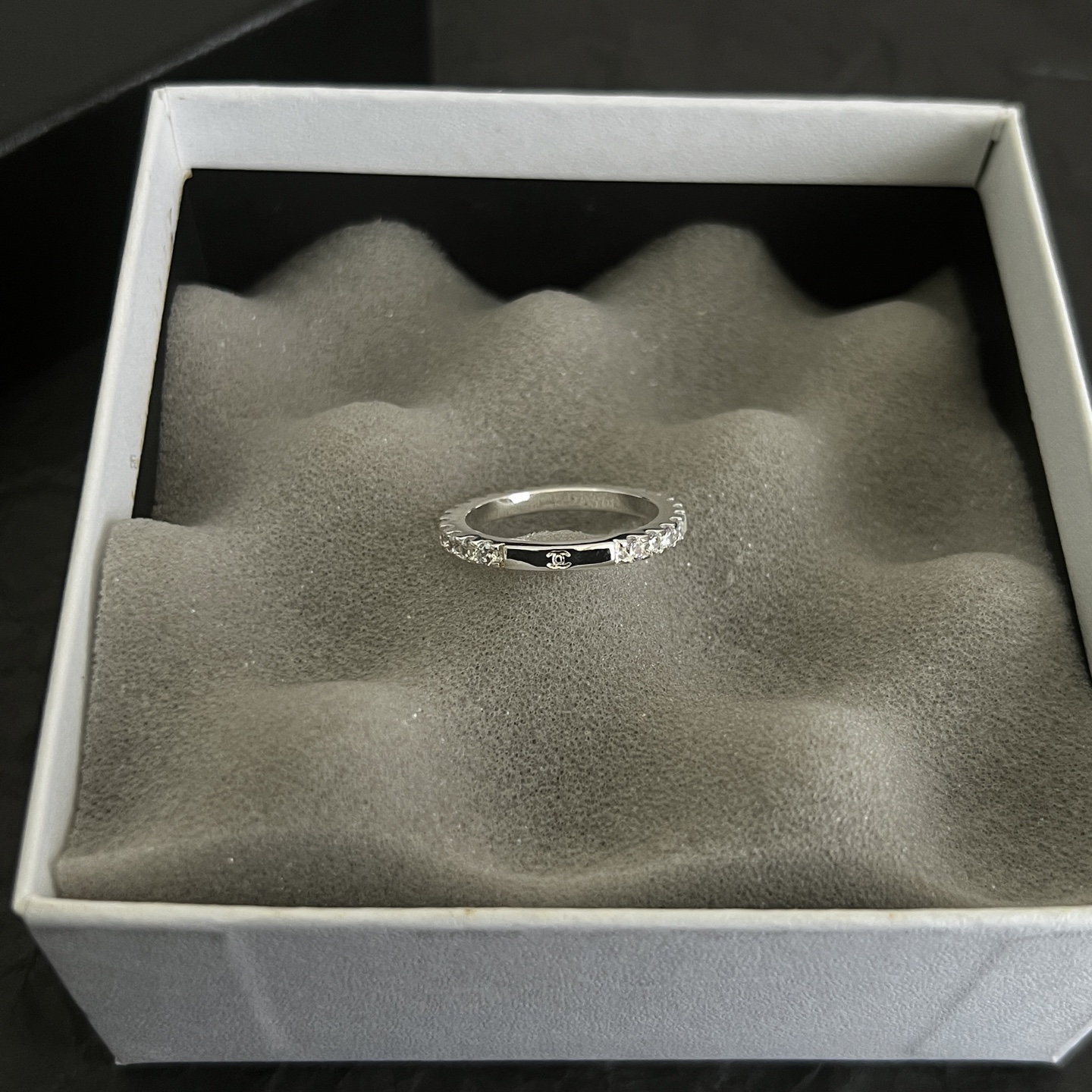 Chanel CC Logo Stackable Band Ring ring Silver-toned metal with clear faceted stones and black enamel accents US 7