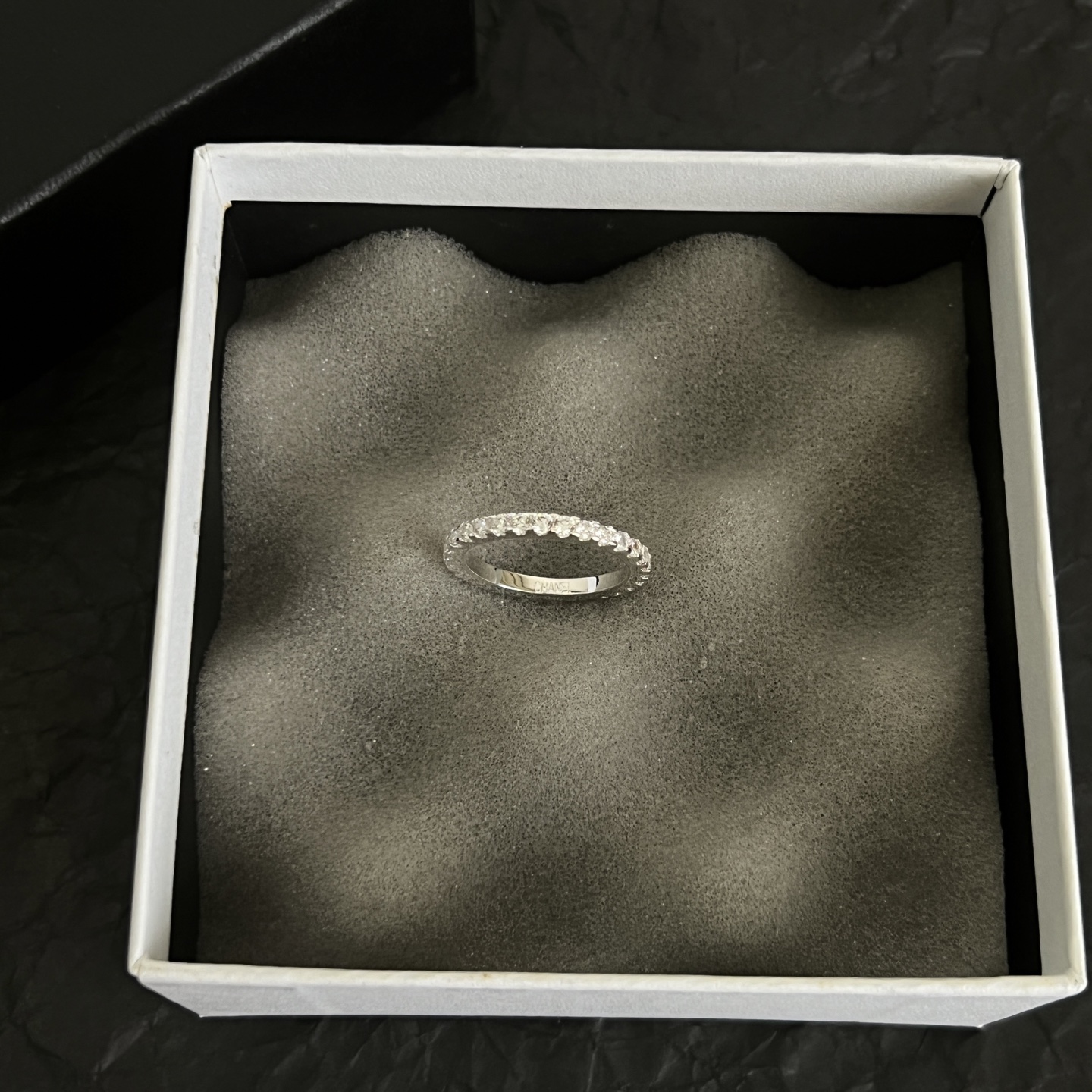 Chanel CC Logo Stackable Band Ring ring Silver-toned metal with clear faceted stones and black enamel accents US 7