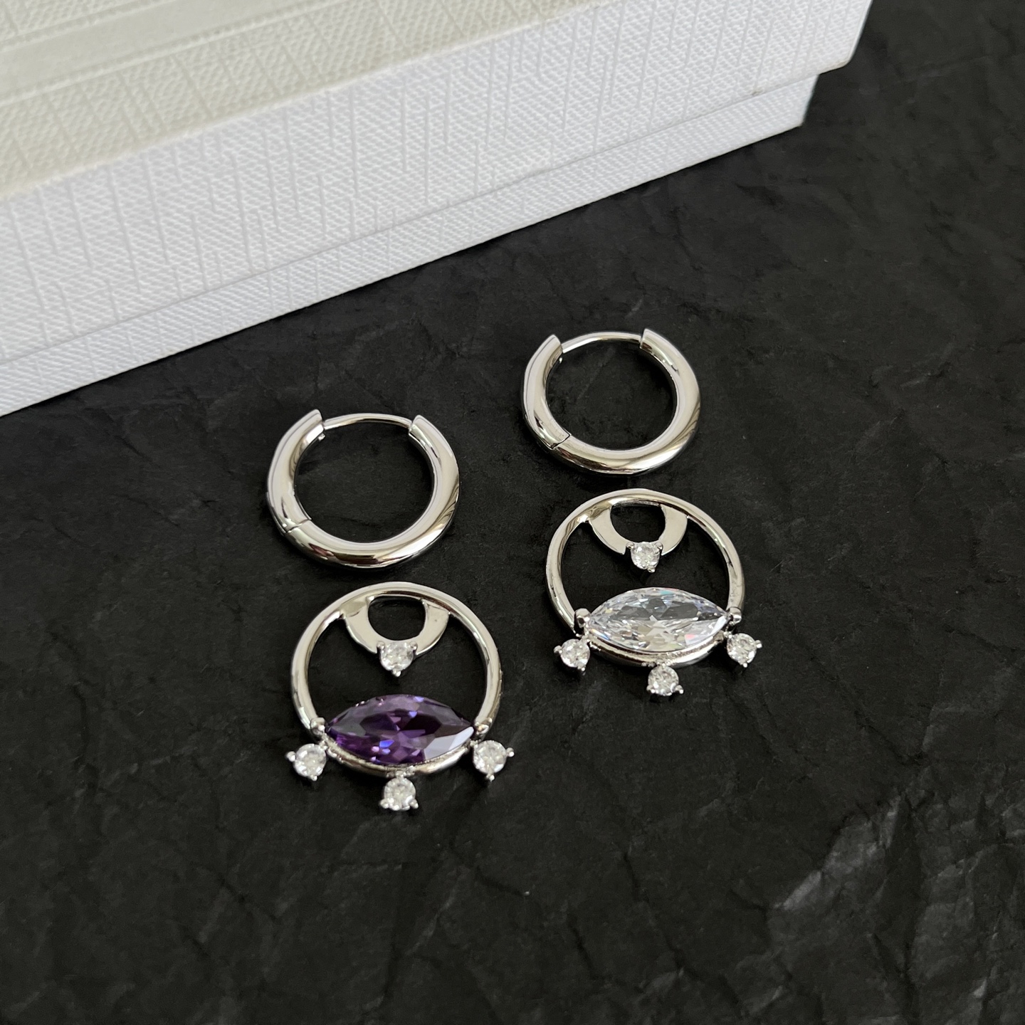 Celine Crystal Interlocking Hoop Earrings earrings Silver-toned metal with clear and purple faceted crystals One Size hoop diameter approx 1 5cm