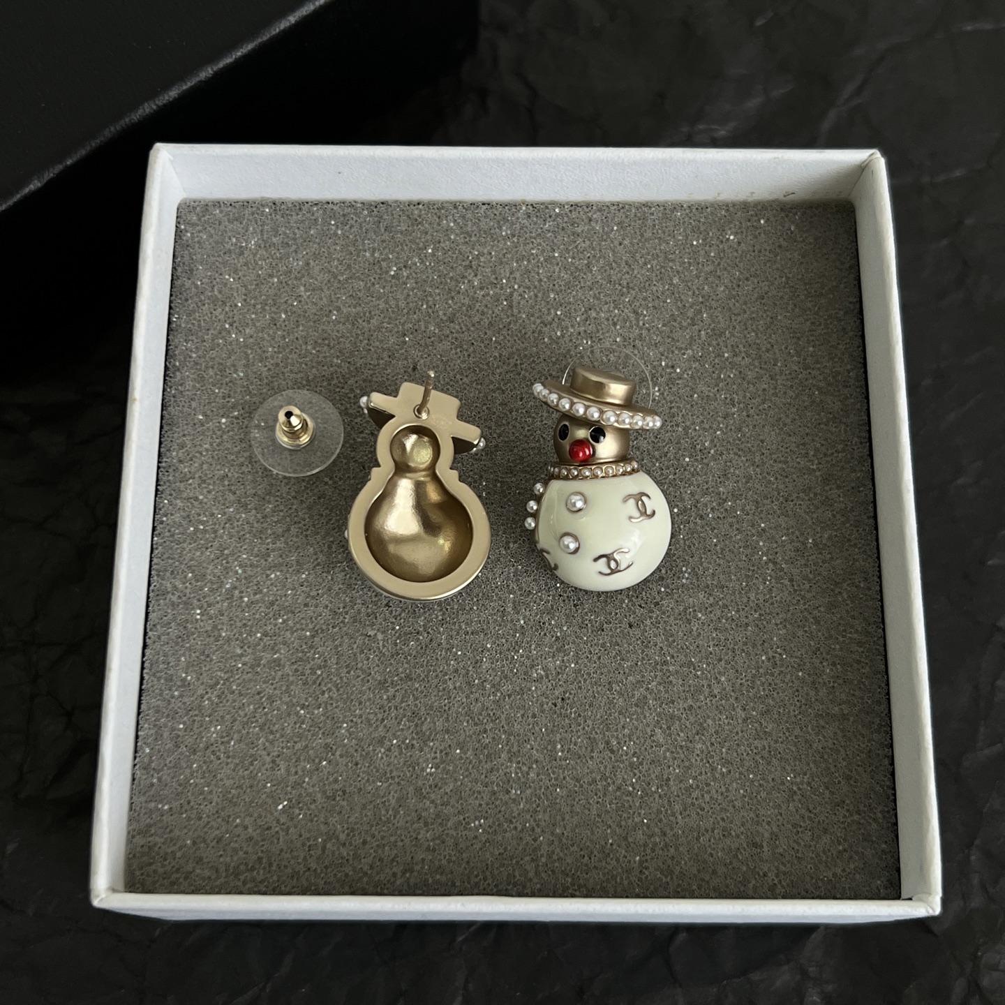 Chanel Snowman CC Holiday Collection earrings Light gold-tone metal cream white enamel clear crystal accents red enamel nose faux pearl trim One Size stud earrings no visible length marking