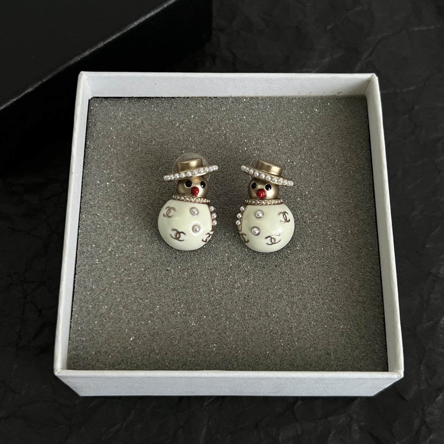 Chanel Snowman CC Holiday Collection earrings Light gold-tone metal cream white enamel clear crystal accents red enamel nose faux pearl trim One Size stud earrings no visible length marking