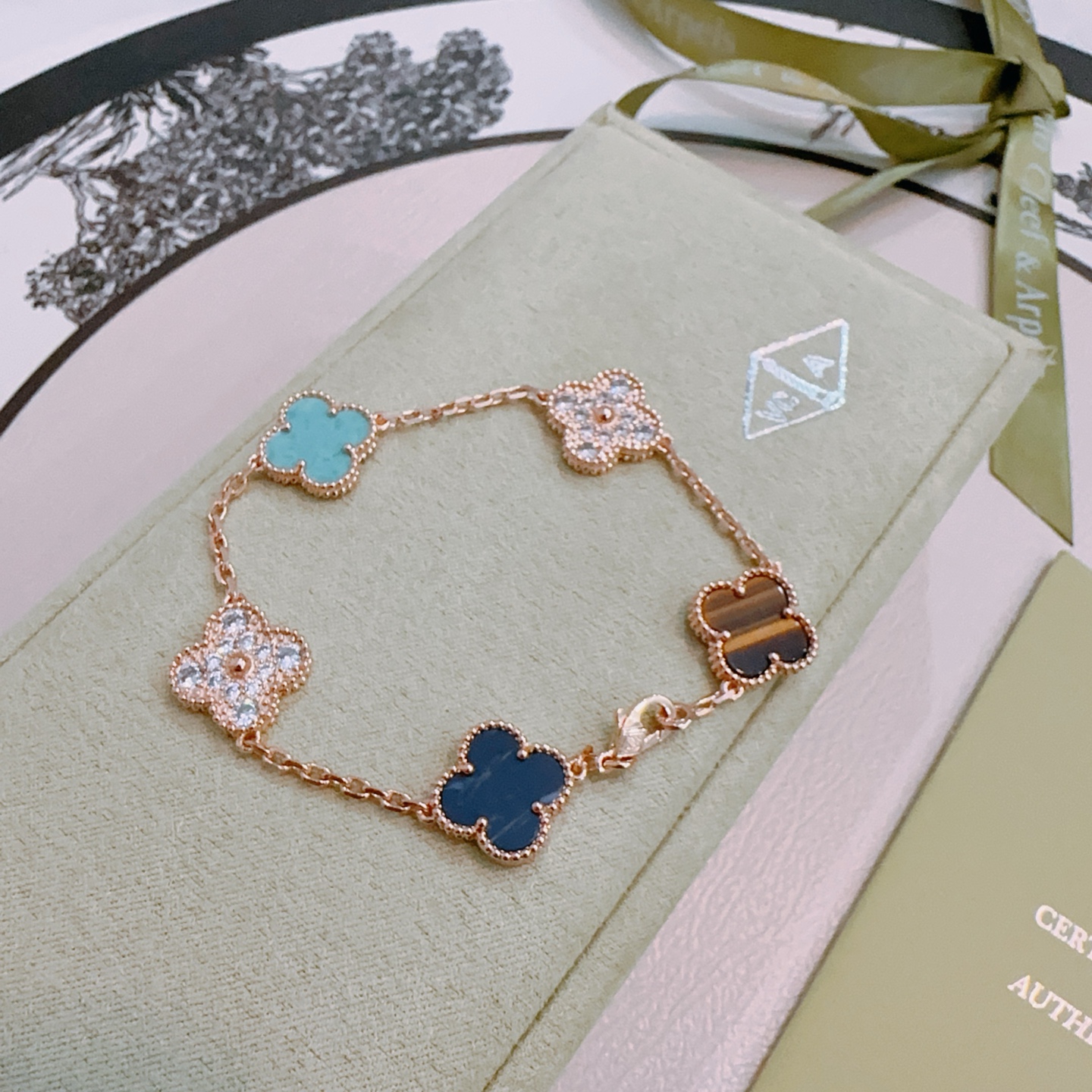 Van Cleef Arpels Alhambra bracelet Rose gold metal with turquoise dark blue stone tiger s eye and clear diamond accents 17cm