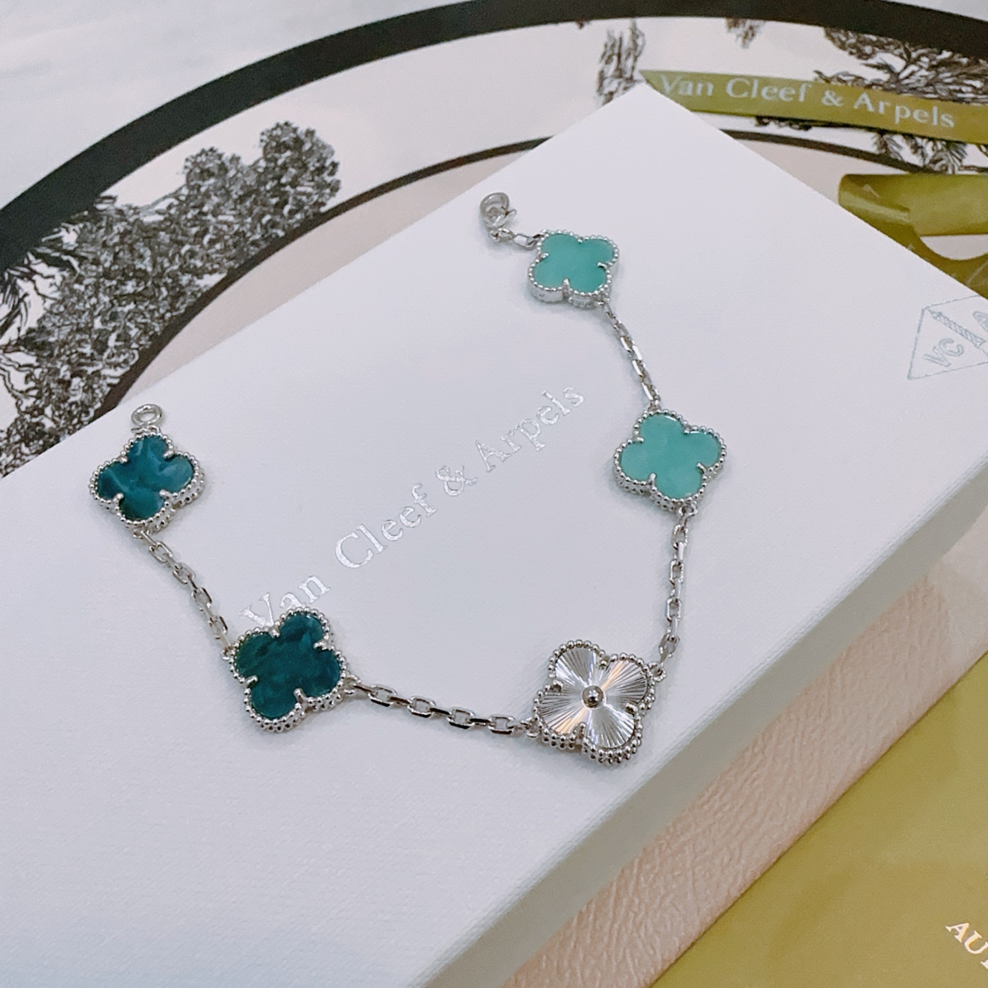 Van Cleef Arpels Alhambra bracelet silver-toned metal with turquoise blue teal blue and silver guilloche four-leaf clover motifs 17cm