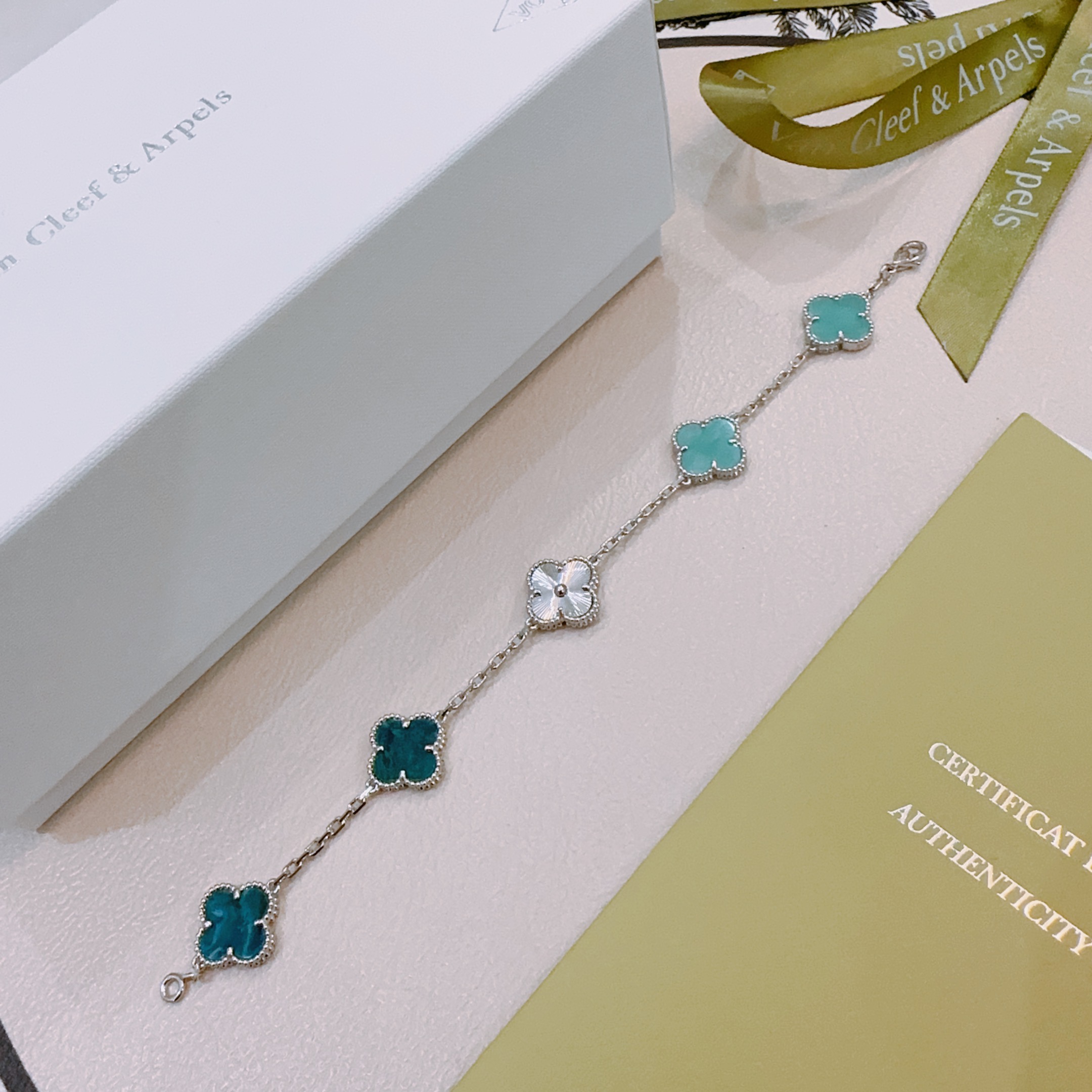 Van Cleef Arpels Alhambra bracelet silver-toned metal with turquoise blue teal blue and silver guilloche four-leaf clover motifs 17cm