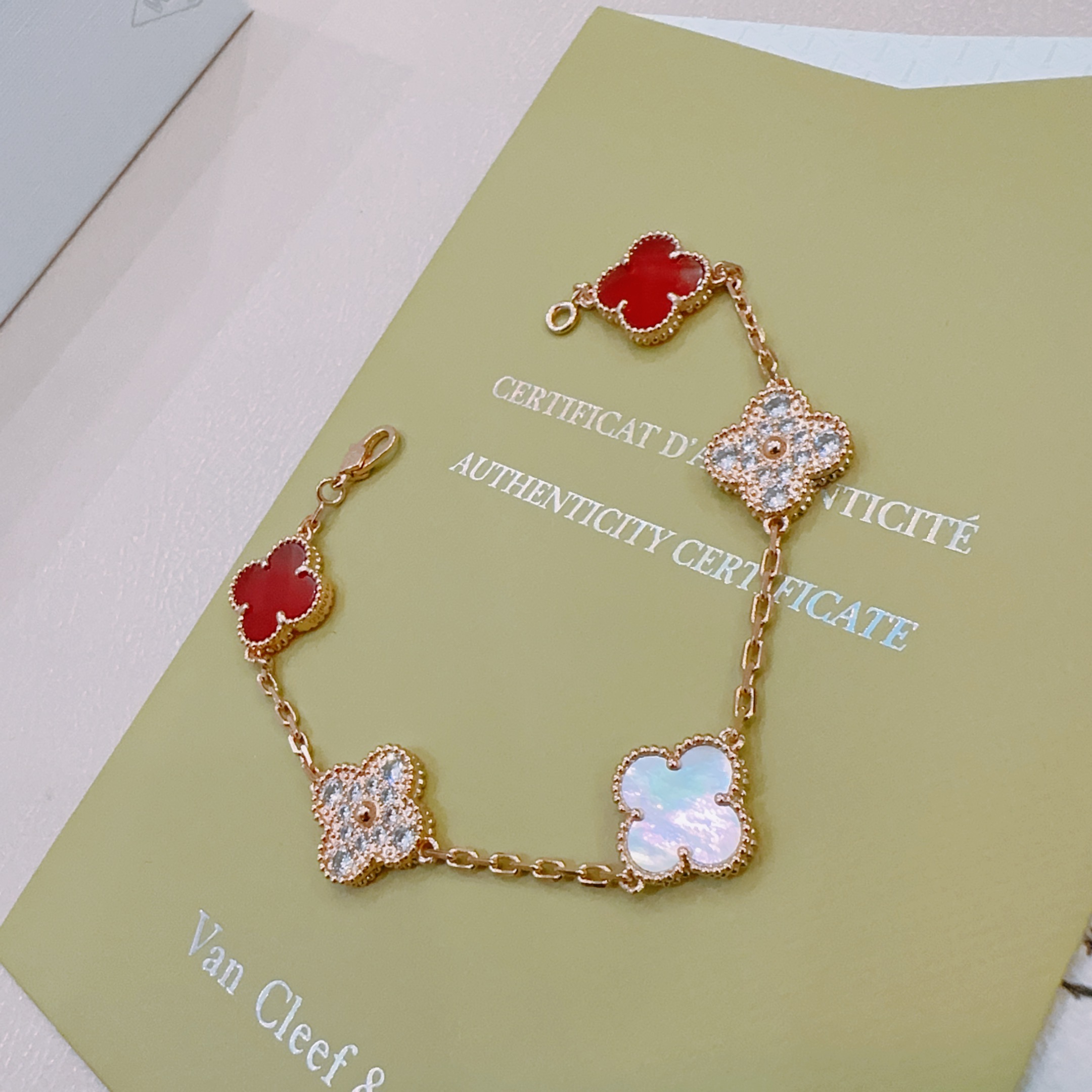 Van Cleef Arpels Alhambra bracelet Rose gold metal with red carnelian white mother-of-pearl and clear diamond accents 18cm