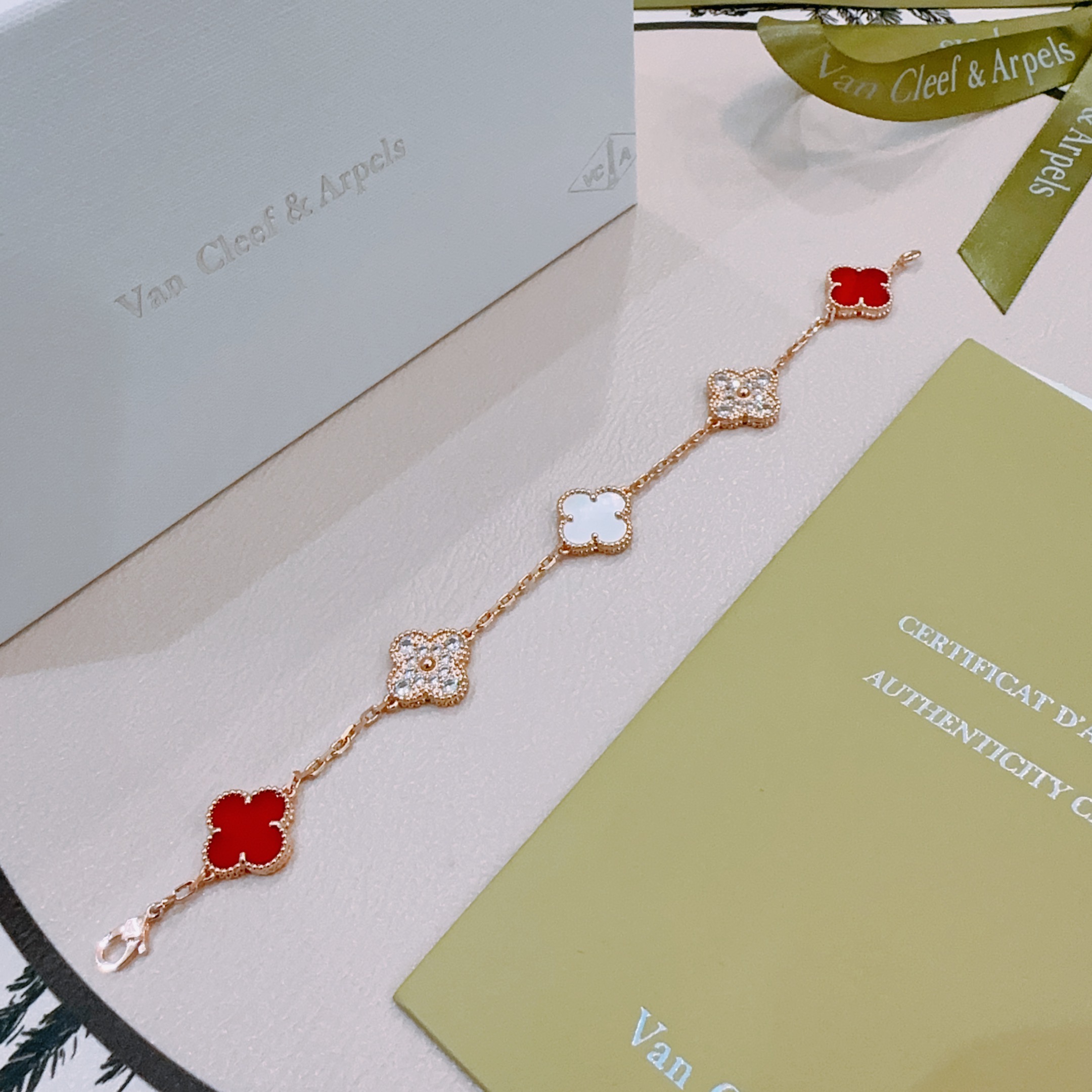 Van Cleef Arpels Alhambra bracelet Rose gold metal with red carnelian white mother-of-pearl and clear diamond accents 18cm