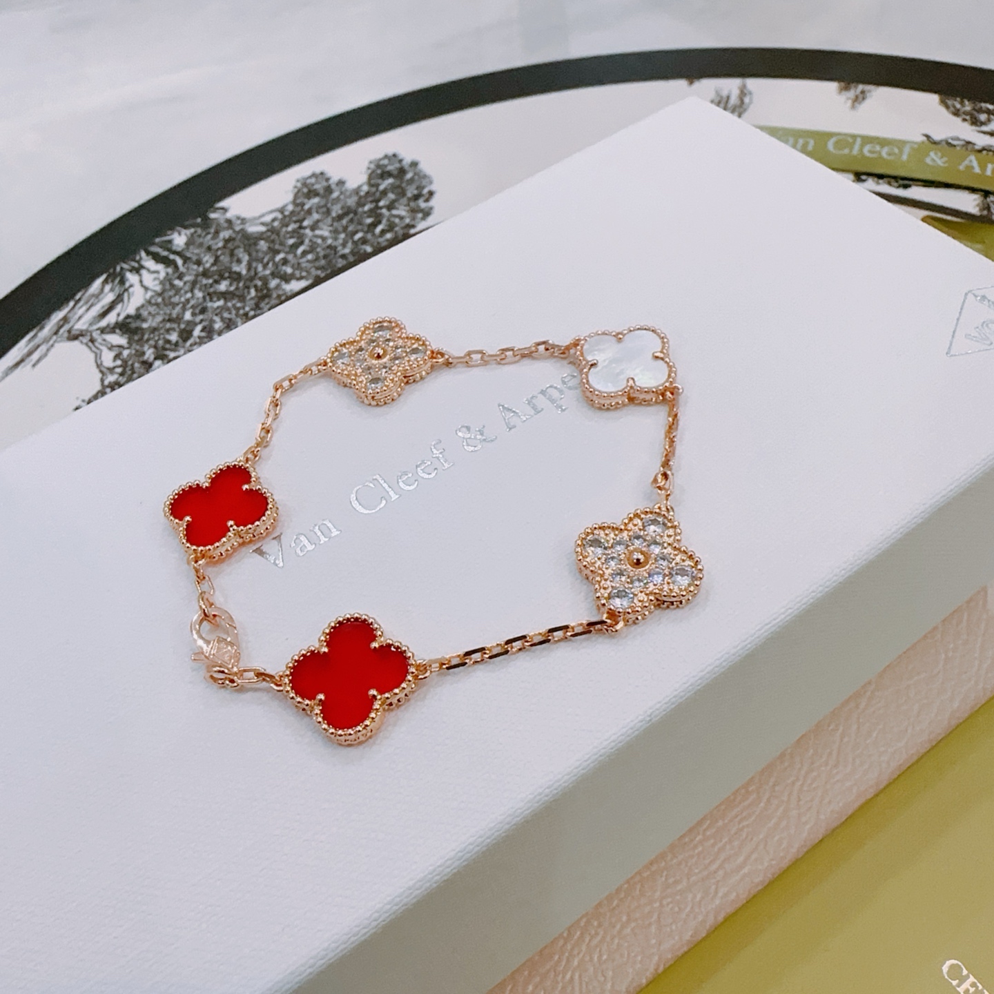 Van Cleef Arpels Alhambra bracelet Rose gold metal with red carnelian white mother-of-pearl and clear diamond accents 18cm