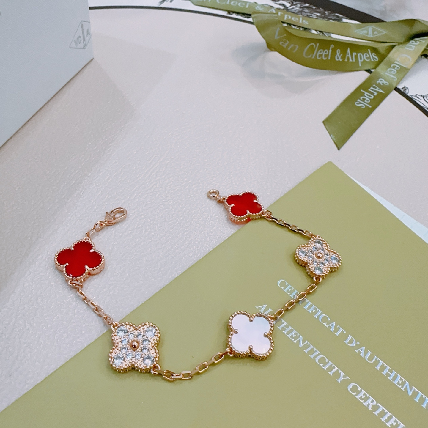 Van Cleef Arpels Alhambra bracelet Rose gold metal with red carnelian white mother-of-pearl and clear diamond accents 18cm