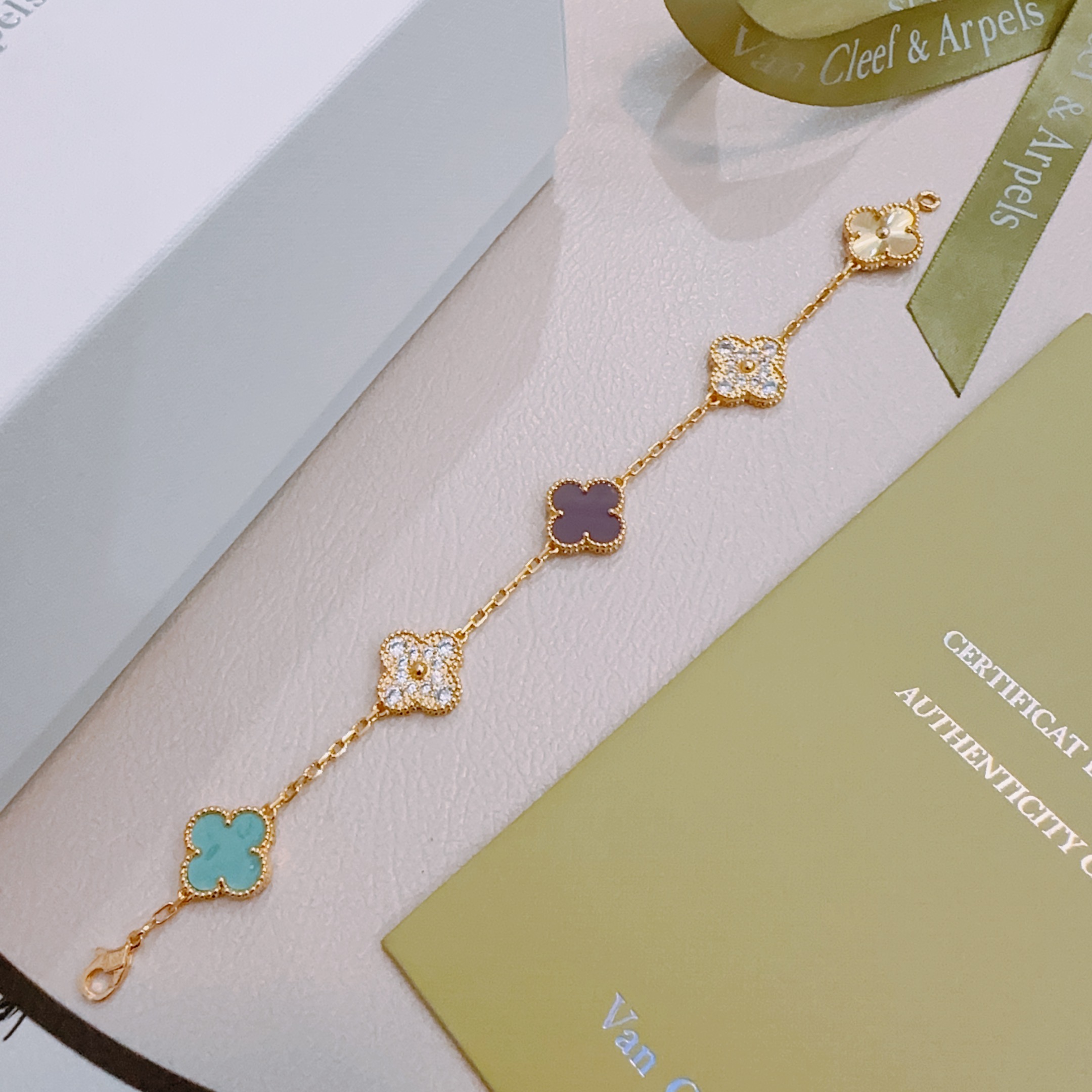 Van Cleef Arpels Alhambra bracelet yellow gold with turquoise purple rhodonite clear diamond and guilloche gold four-leaf clover motifs 17cm