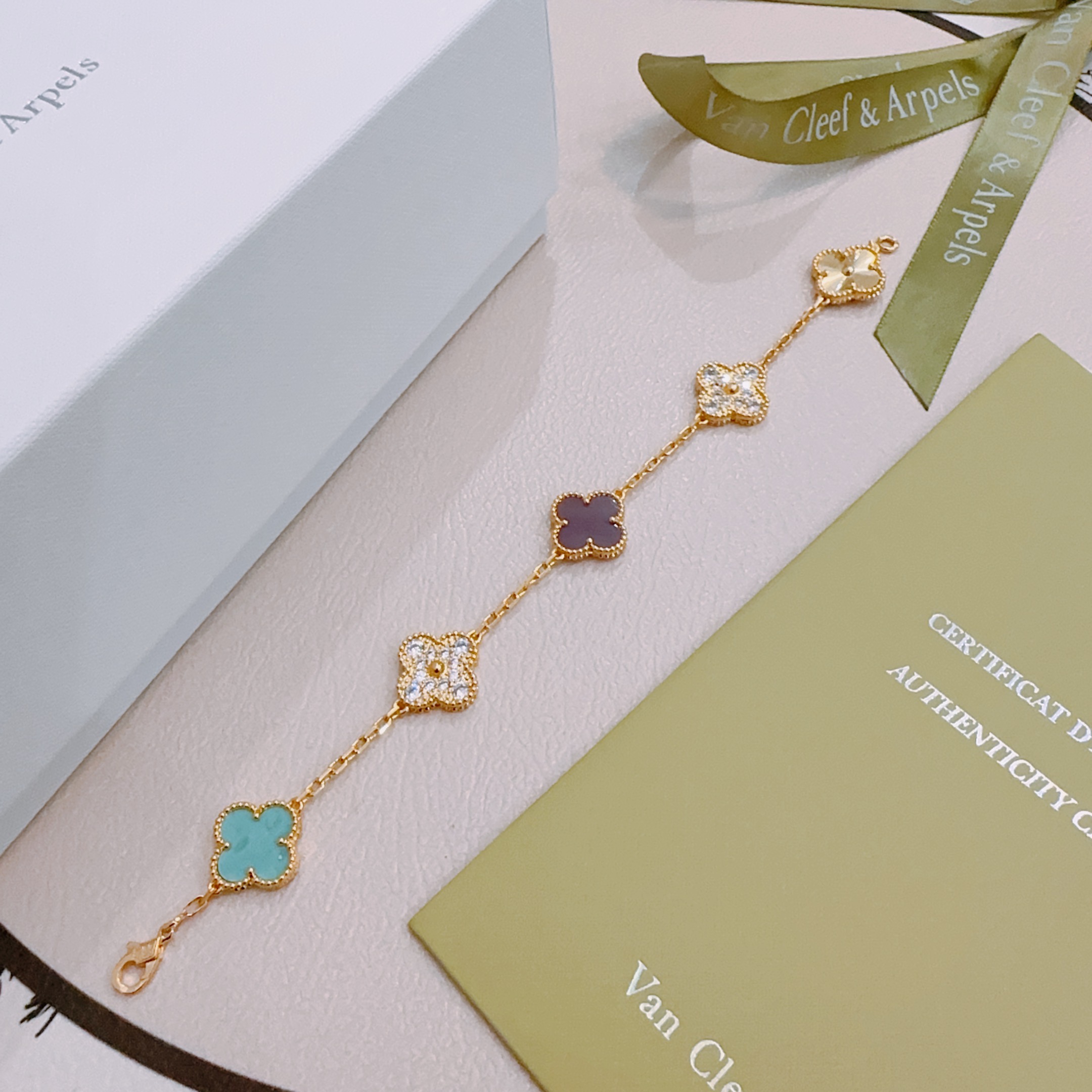 Van Cleef Arpels Alhambra bracelet yellow gold with turquoise purple rhodonite clear diamond and guilloche gold four-leaf clover motifs 17cm