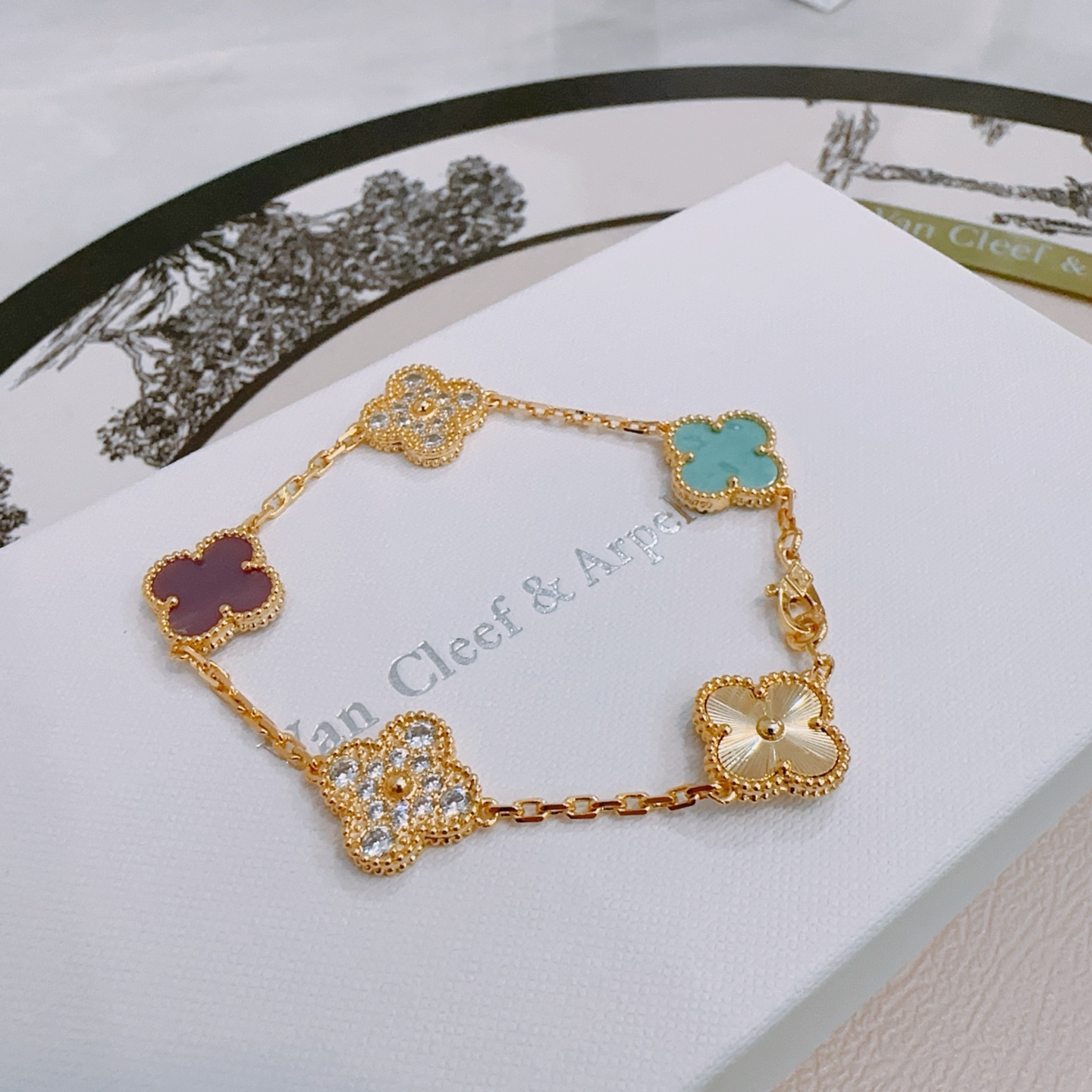 Van Cleef Arpels Alhambra bracelet yellow gold with turquoise purple rhodonite clear diamond and guilloche gold four-leaf clover motifs 17cm