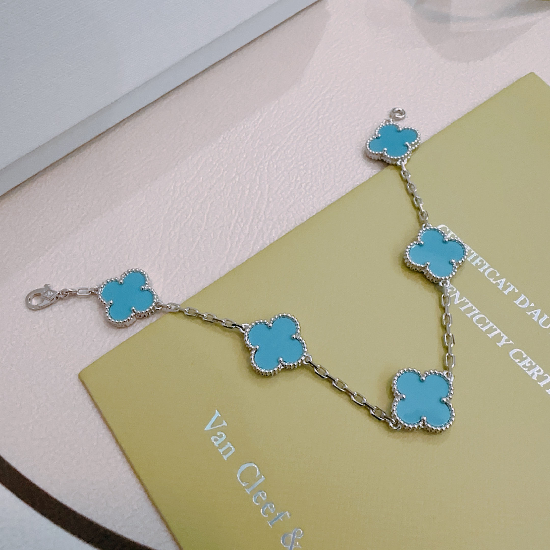 Van Cleef Arpels Alhambra bracelet silver-toned metal with turquoise blue clover inlays 17cm