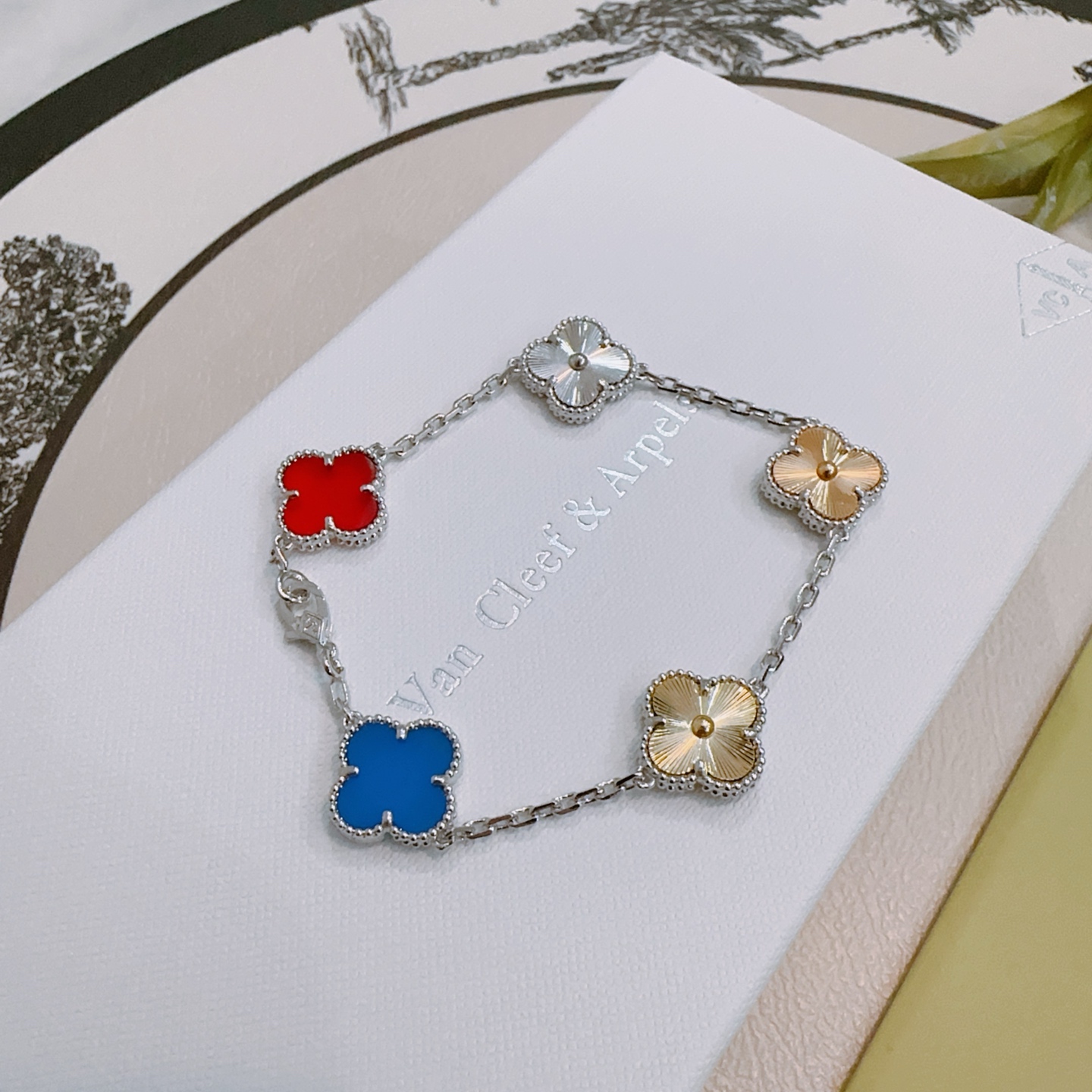 Van Cleef Arpels Alhambra bracelet Silver-toned metal with red blue gold and silver four-leaf clover motifs 17cm