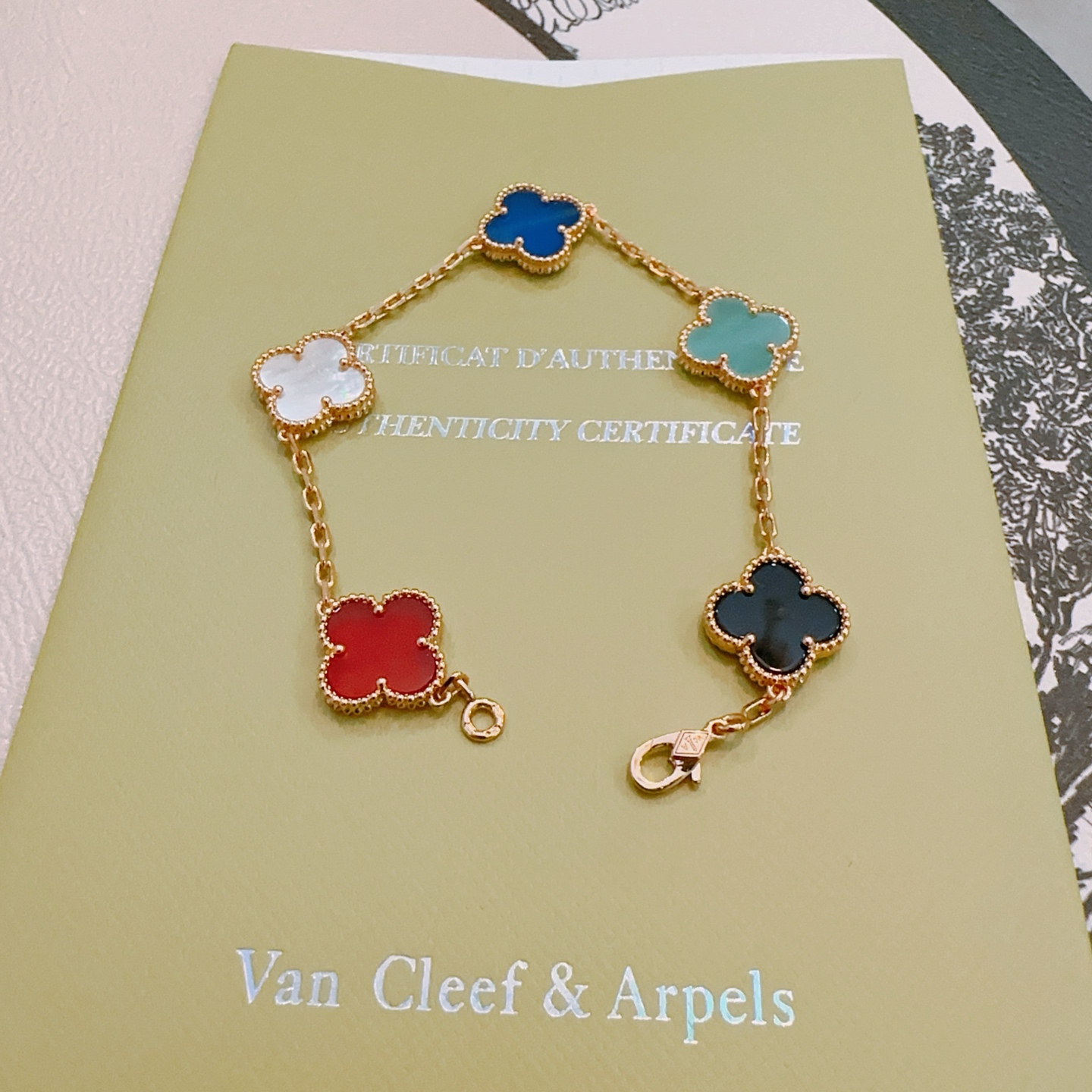 Van Cleef Arpels Alhambra bracelet Rose gold metal with red white mother-of-pearl royal blue turquoise black onyx clover inlays 18cm
