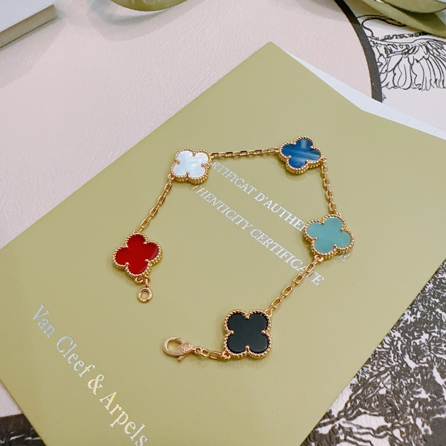 Van Cleef Arpels Alhambra bracelet Rose gold metal with red white mother-of-pearl royal blue turquoise black onyx clover inlays 18cm