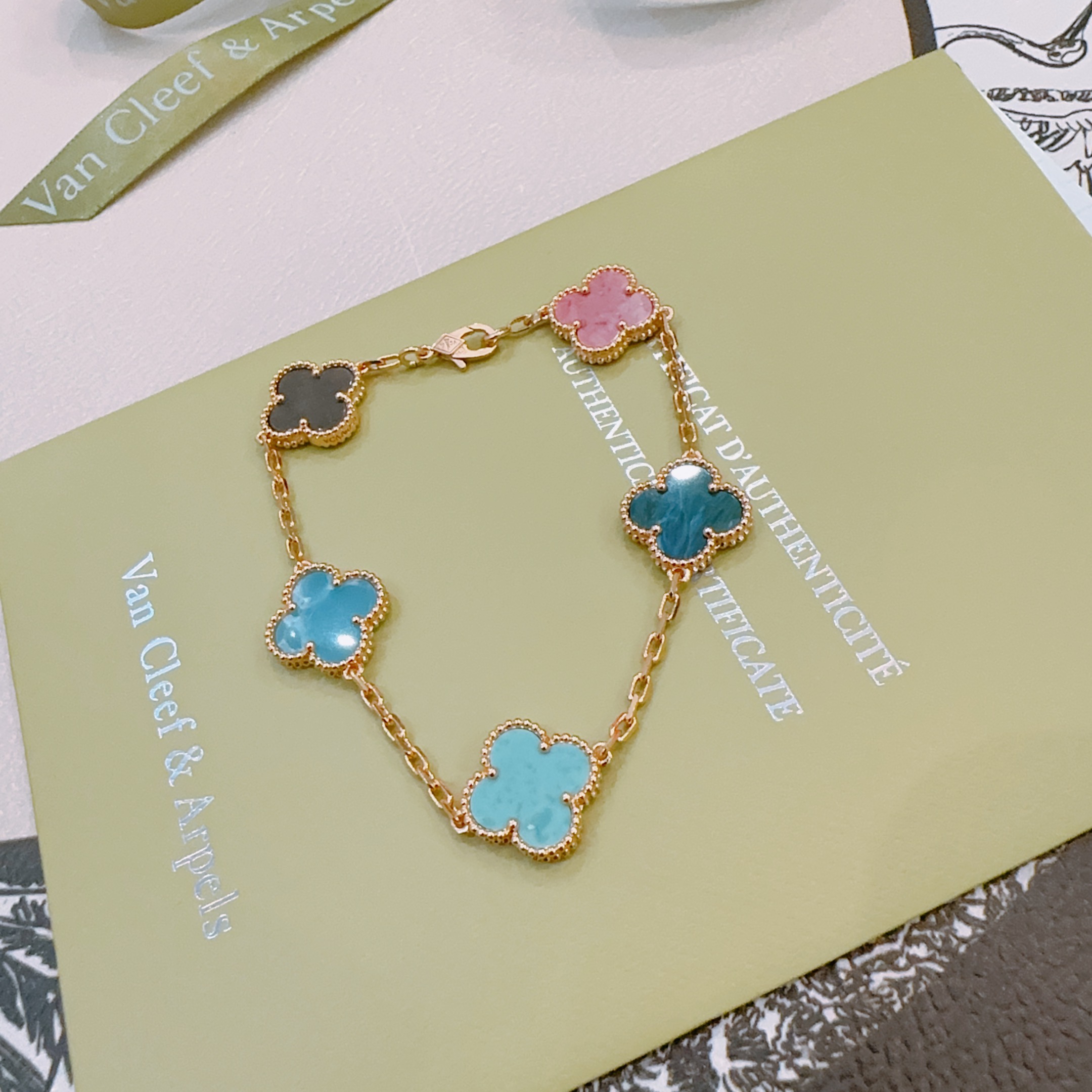 Van Cleef Arpels Vintage Alhambra bracelet Rose gold metal with multicolor clover stones including dark gray pink light sky blue teal blue and turquoise 18cm