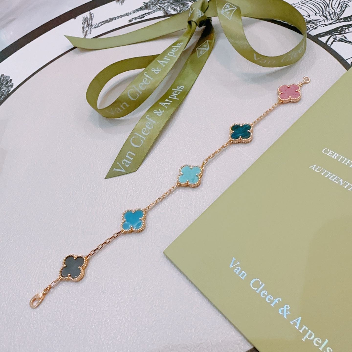 Van Cleef Arpels Vintage Alhambra bracelet Rose gold metal with multicolor clover stones including dark gray pink light sky blue teal blue and turquoise 18cm