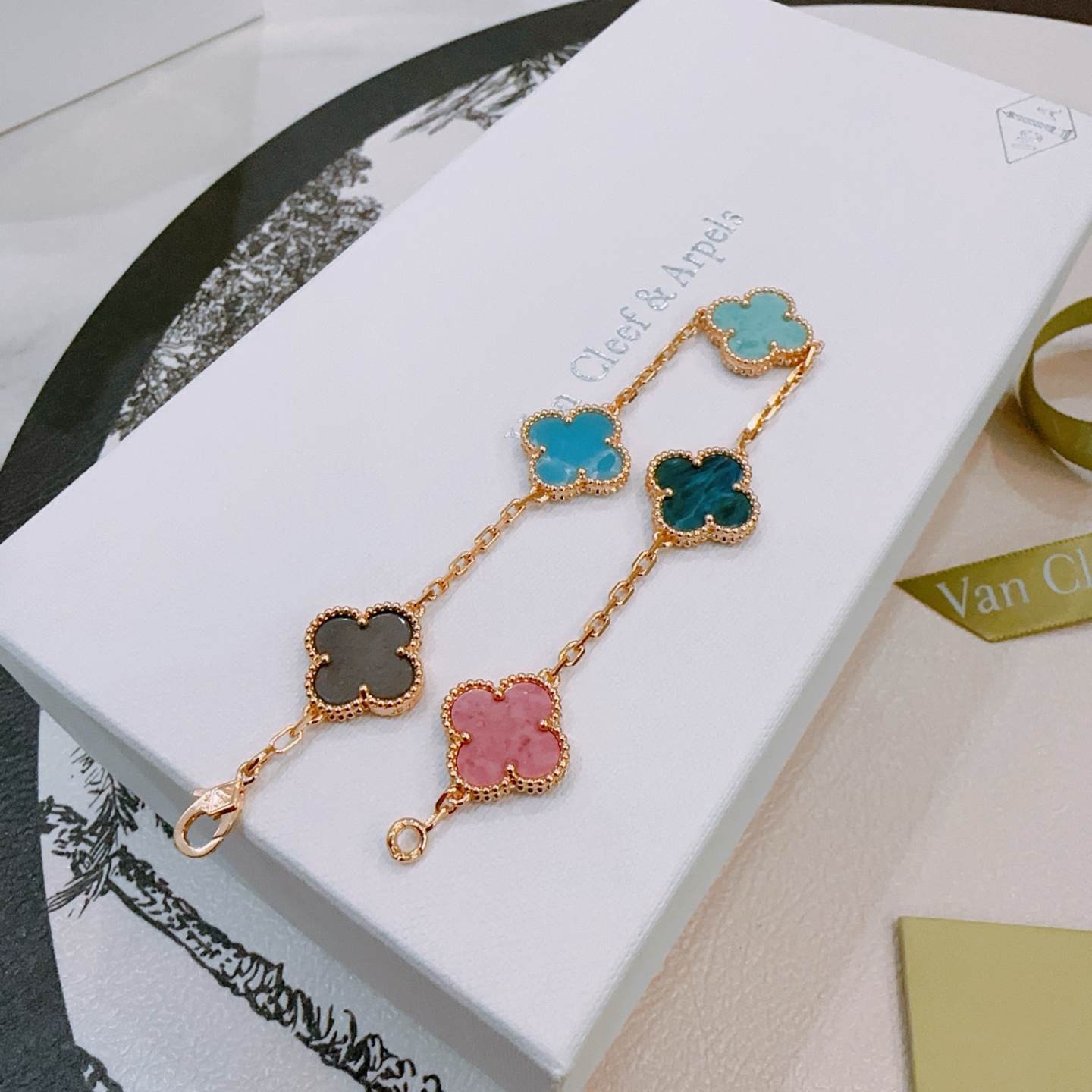 Van Cleef Arpels Vintage Alhambra bracelet Rose gold metal with multicolor clover stones including dark gray pink light sky blue teal blue and turquoise 18cm