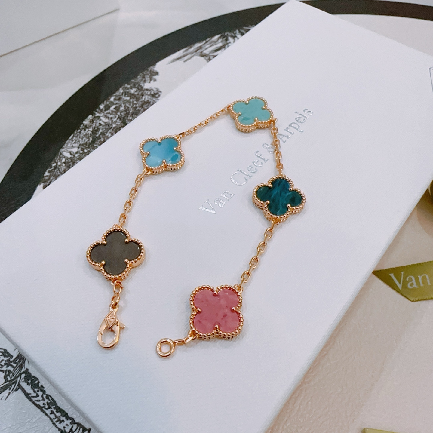 Van Cleef Arpels Vintage Alhambra bracelet Rose gold metal with multicolor clover stones including dark gray pink light sky blue teal blue and turquoise 18cm