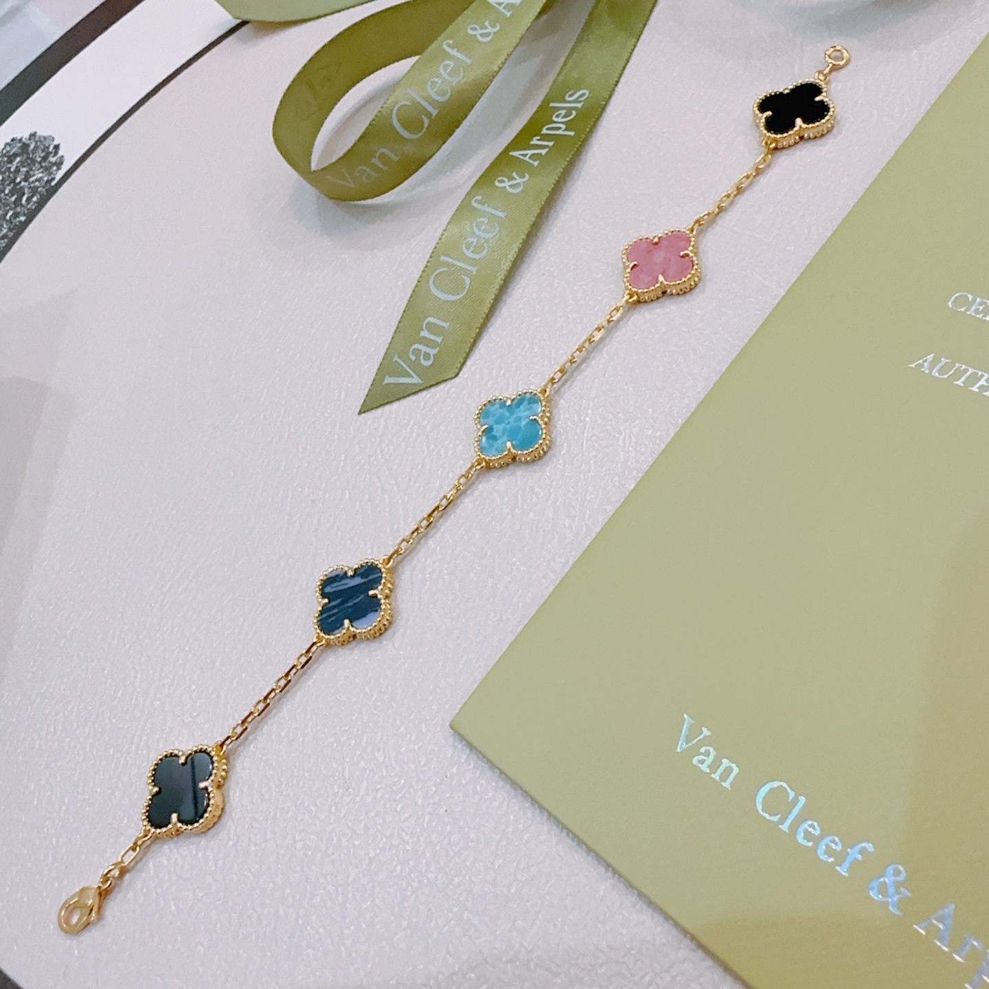 Van Cleef Arpels Alhambra bracelet Gold-toned metal with turquoise blue dark blue pink and black clover inlays 19cm