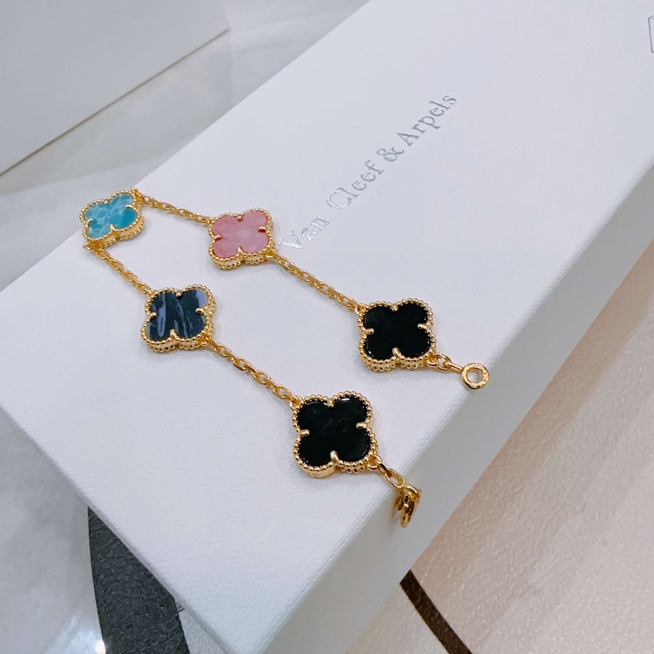 Van Cleef Arpels Alhambra bracelet Gold-toned metal with turquoise blue dark blue pink and black clover inlays 19cm