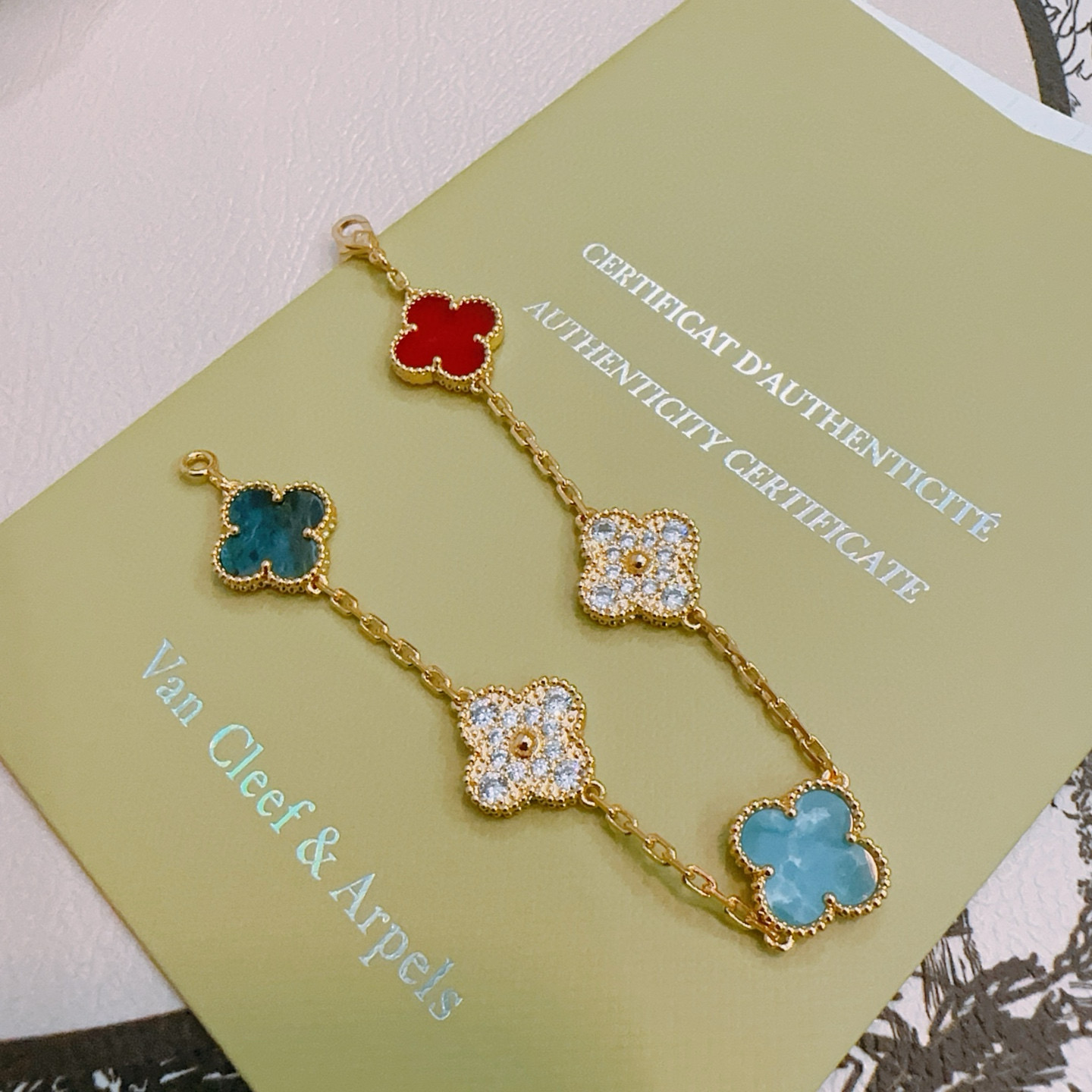 Van Cleef Arpels Alhambra bracelet Gold metal with red turquoise blue teal blue and clear diamond-accented four-leaf clover motifs 17cm