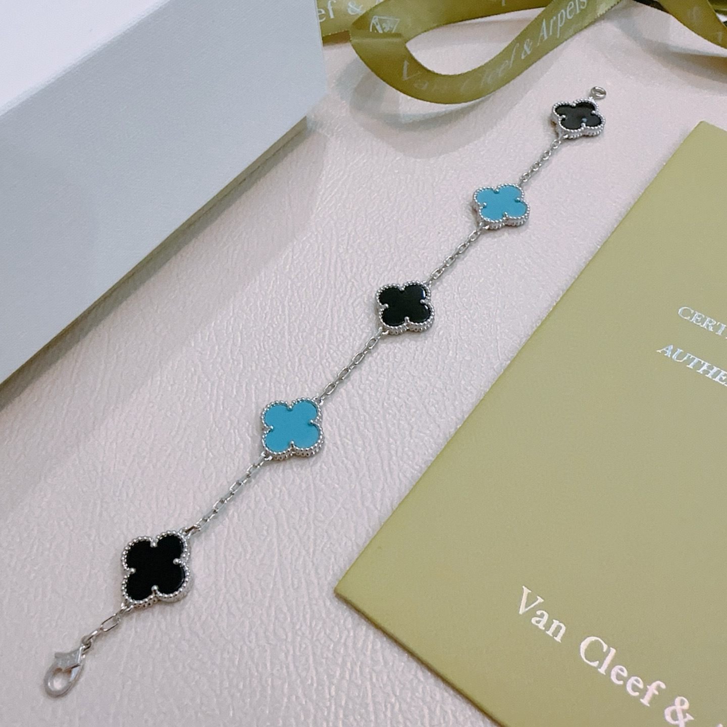 Van Cleef Arpels Alhambra bracelet silver-toned metal with black onyx and turquoise blue clover inlays 17cm