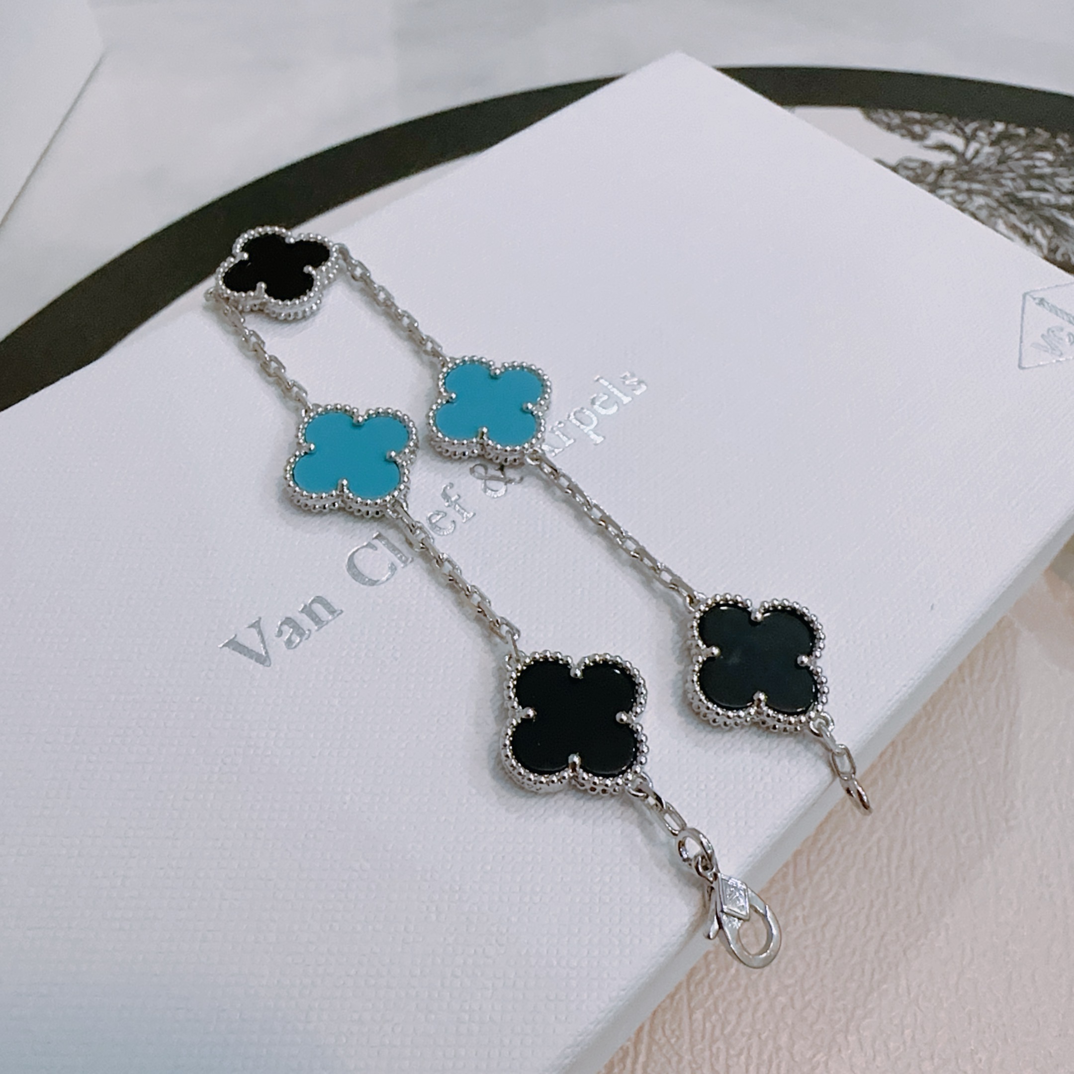 Van Cleef Arpels Alhambra bracelet silver-toned metal with black onyx and turquoise blue clover inlays 17cm