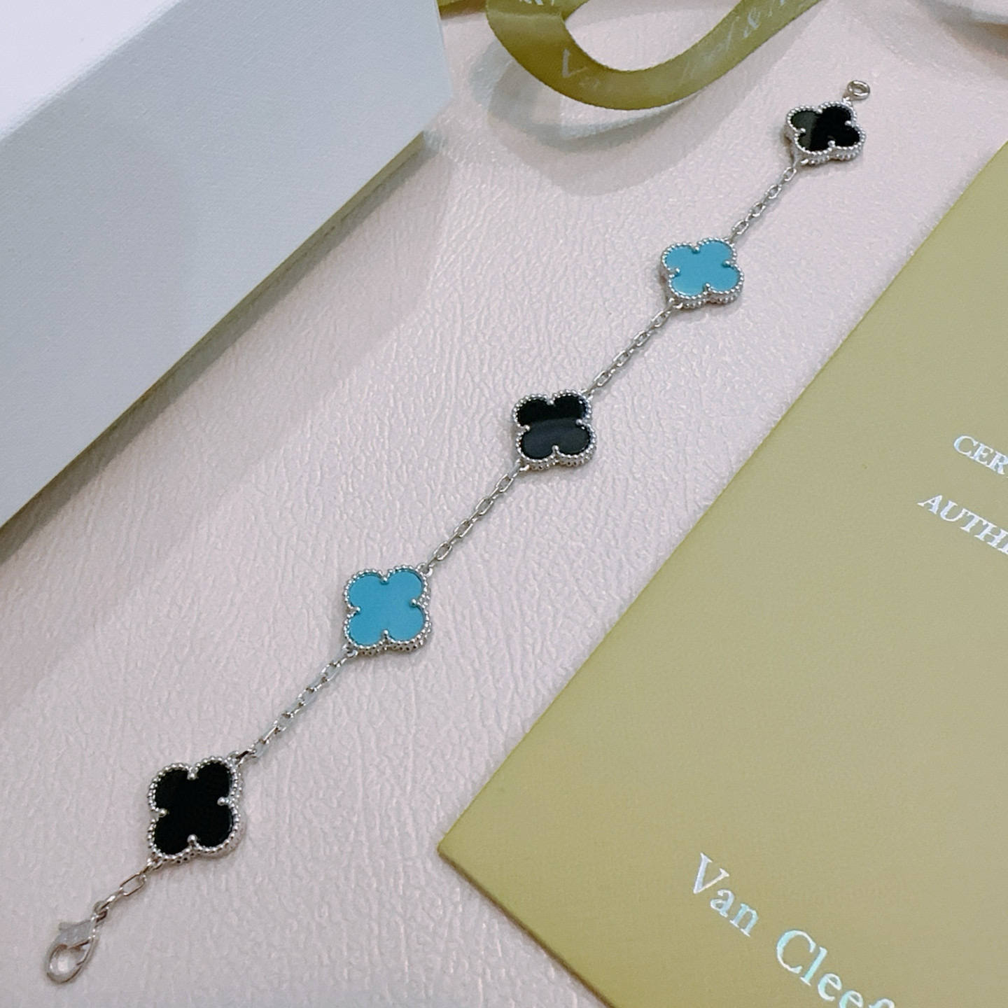 Van Cleef Arpels Alhambra bracelet silver-toned metal with black onyx and turquoise blue clover inlays 17cm