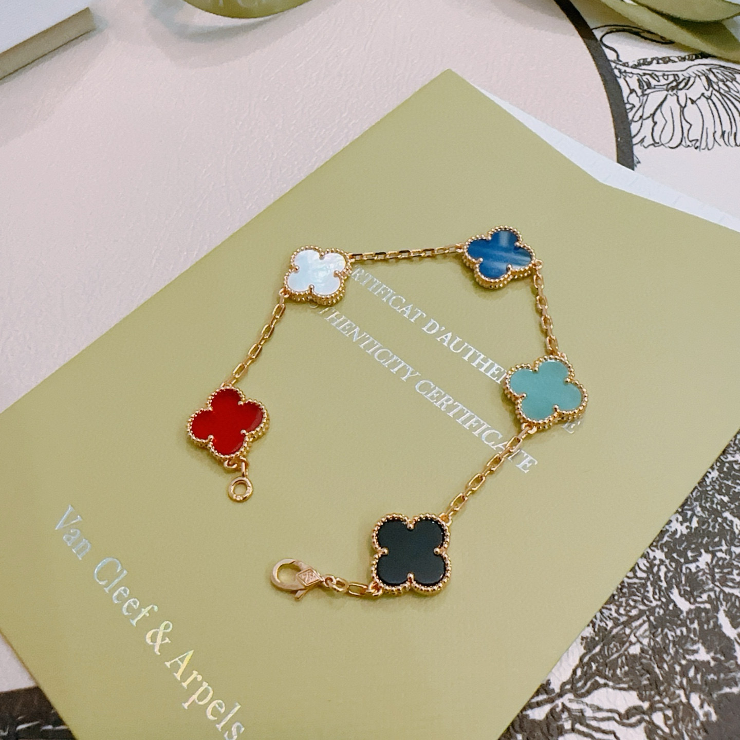 Van Cleef Arpels Alhambra bracelet Rose gold metal with red carnelian white mother-of-pearl blue agate turquoise black onyx clover motifs 18cm