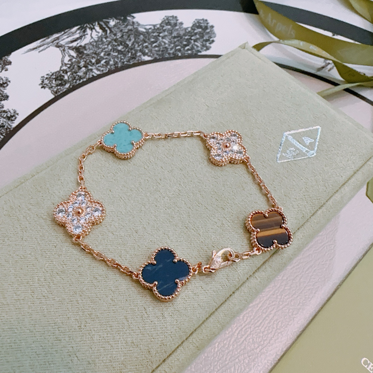 Van Cleef Arpels Alhambra bracelet Rose gold with turquoise dark blue stone tiger s eye and clear diamond accents 18cm